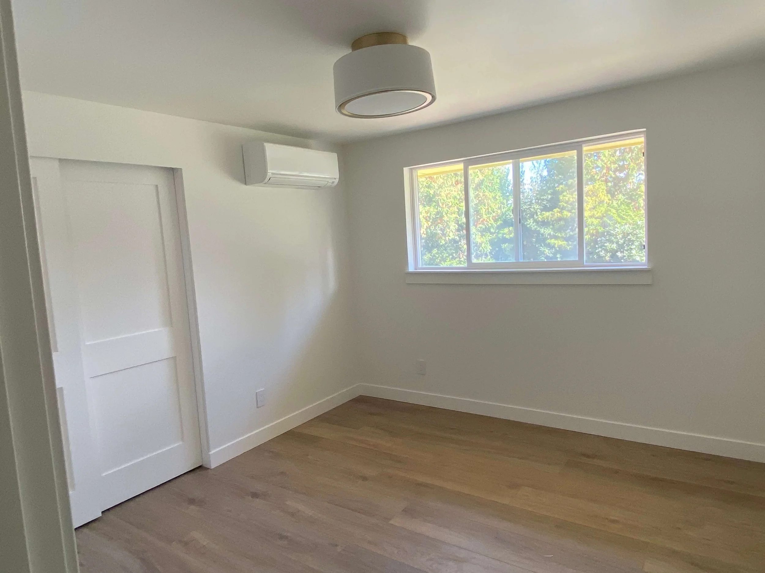 After drywall installation in a Redmond WA home with skim-coated smooth walls and ceilings, finished with professional interior painting.
