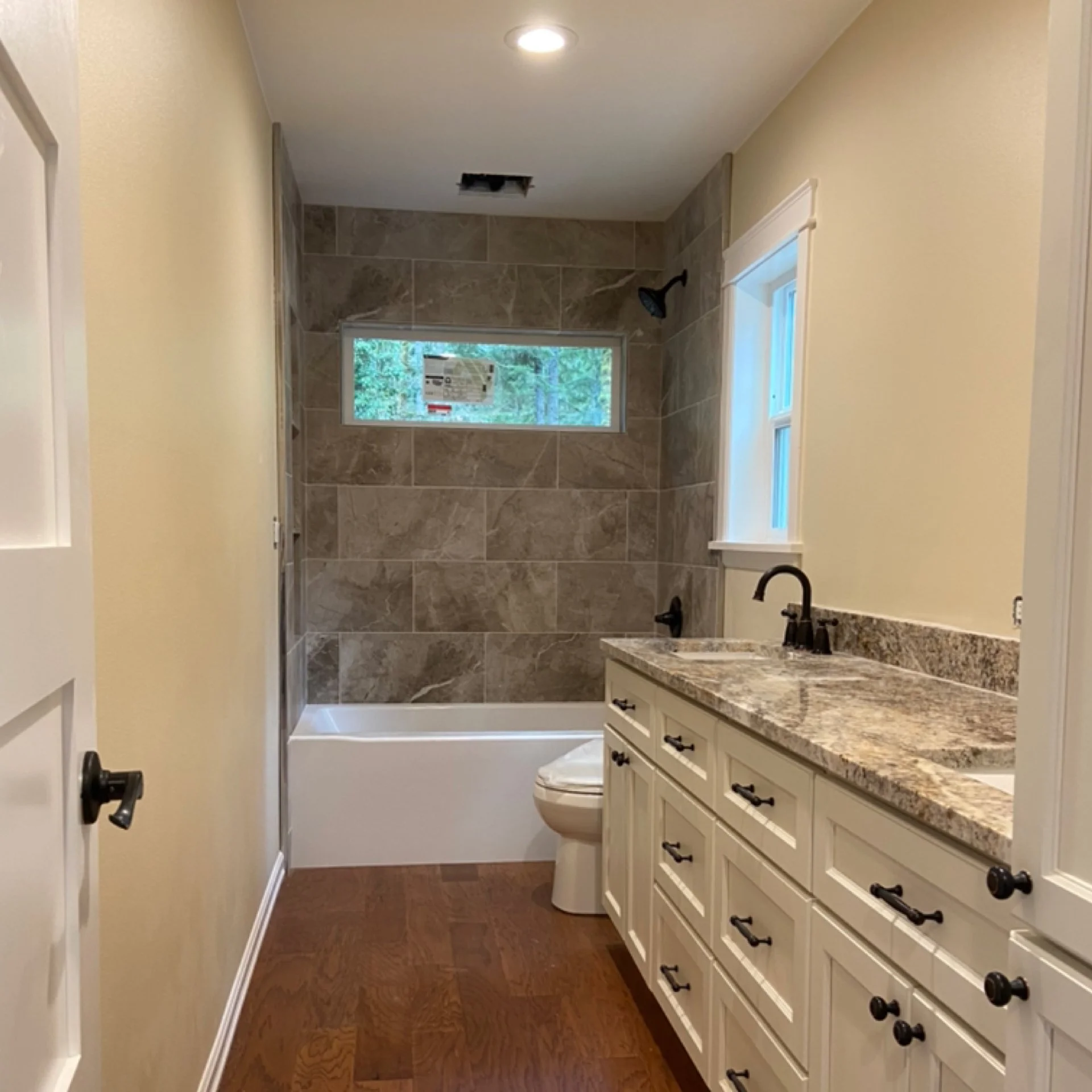 Bathroom drywall installation with skim coating and moisture-resistant painted finish in Kirkland, WA