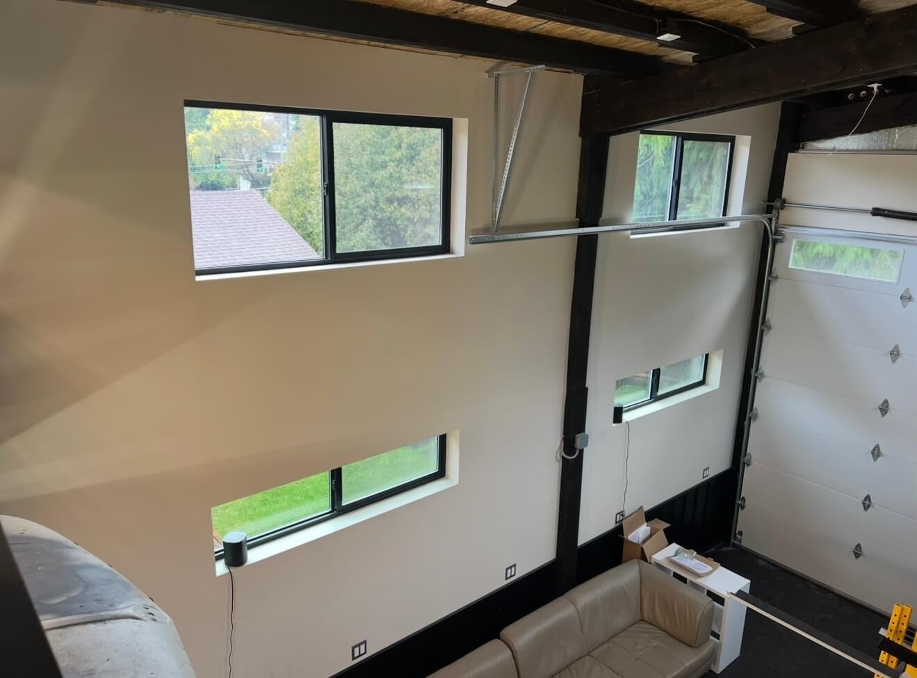 Finished Seattle garage with insulation, drywall installation, Level 4 finish, primer, and paint
