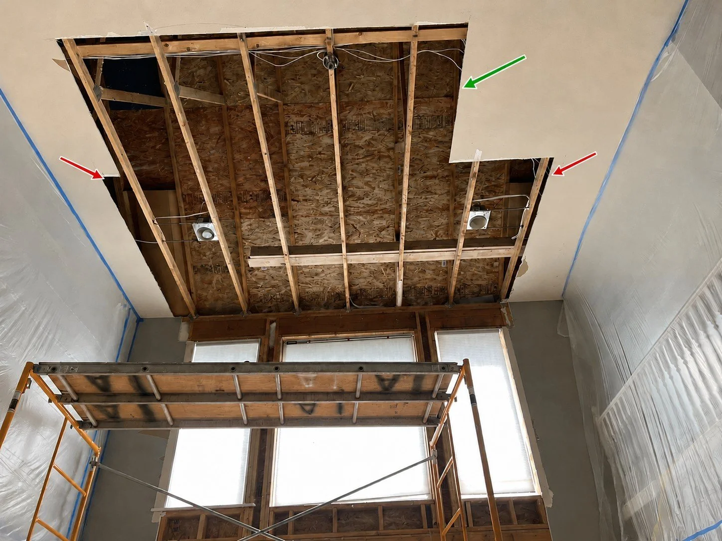 Ceiling drywall repair opening with arrows marking unsupported edges that need wood backing or trimming to ceiling framing before patching