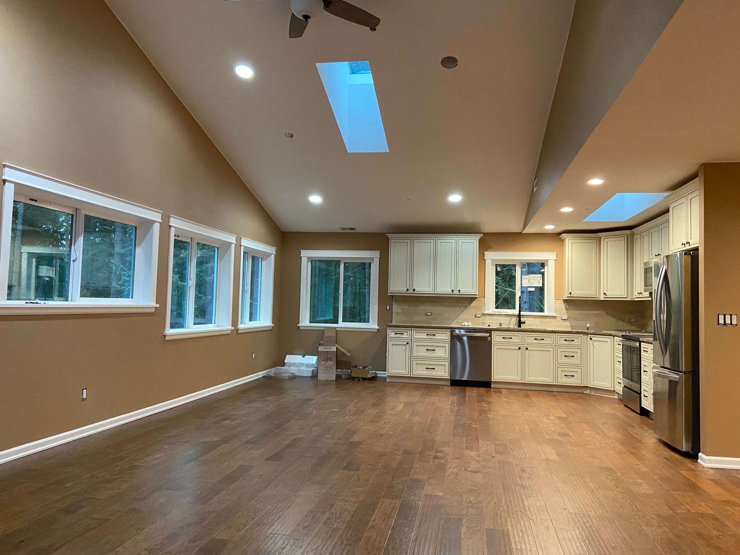 Completed Issaquah ADU interior with Level 4 drywall, painted walls and ceilings, and skylights.