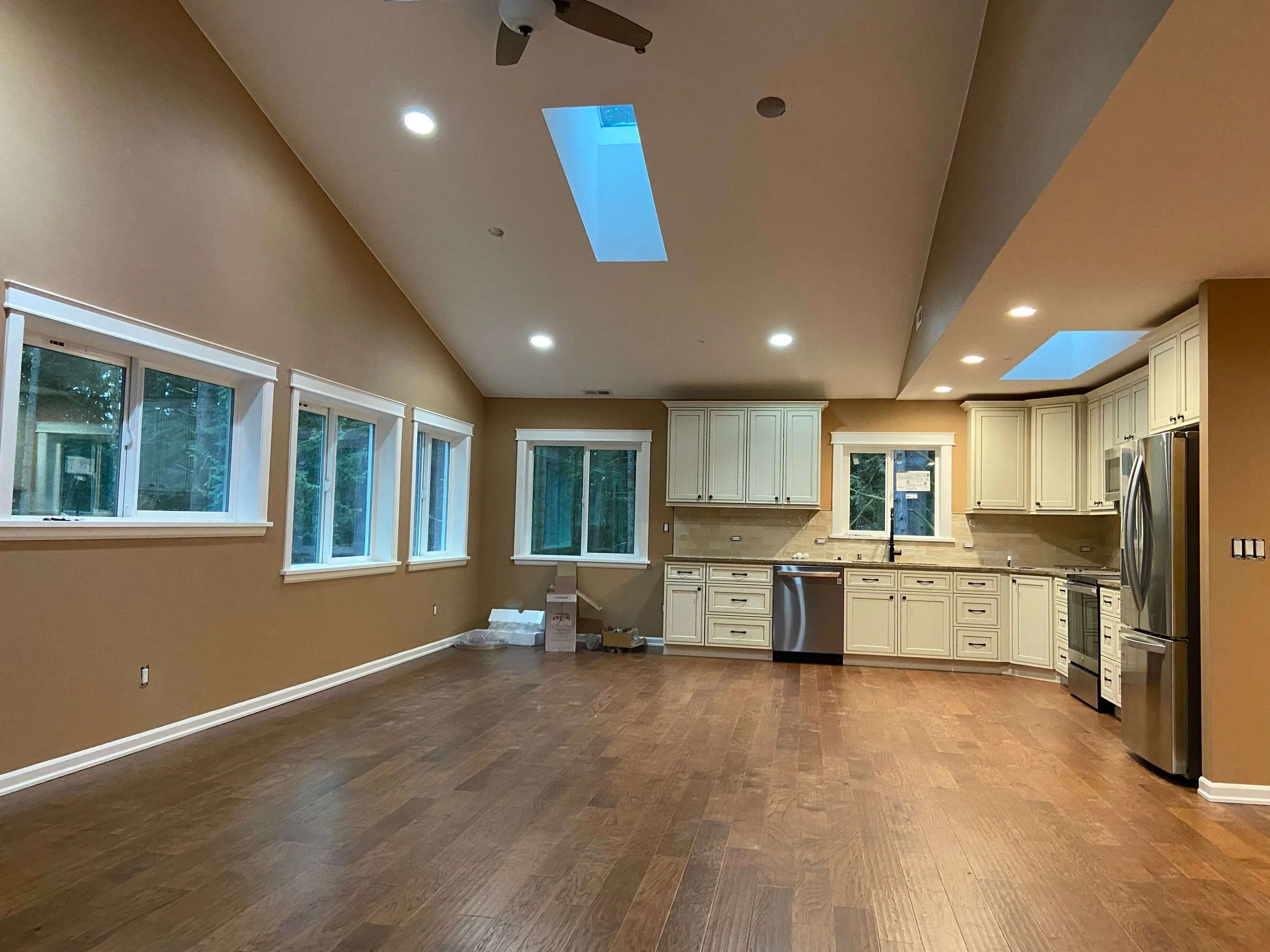 Finished Issaquah, WA ADU with Level 4 smooth drywall, vaulted ceiling, skylights, painted walls, and an open kitchen