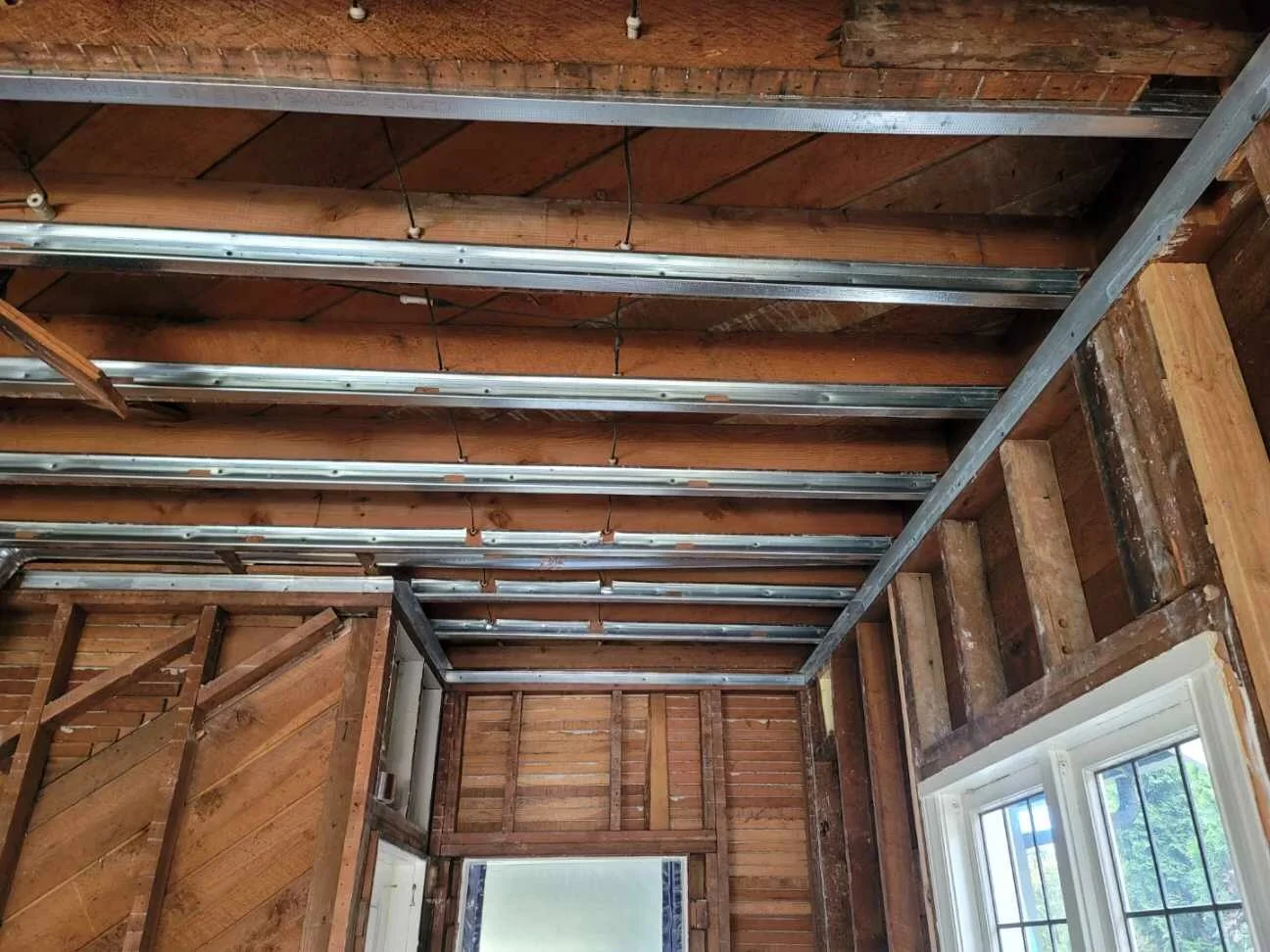 Pre-drywall wall preparation, shimming, and framing correction for Level 5 drywall installation in Bellevue, WA