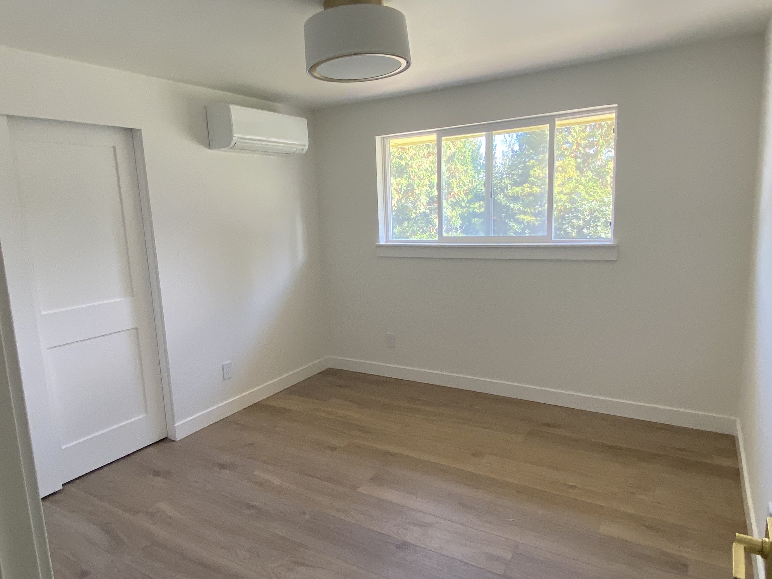 After Level 5 drywall repair in Redmond WA with skim coated smooth walls and modern finish.