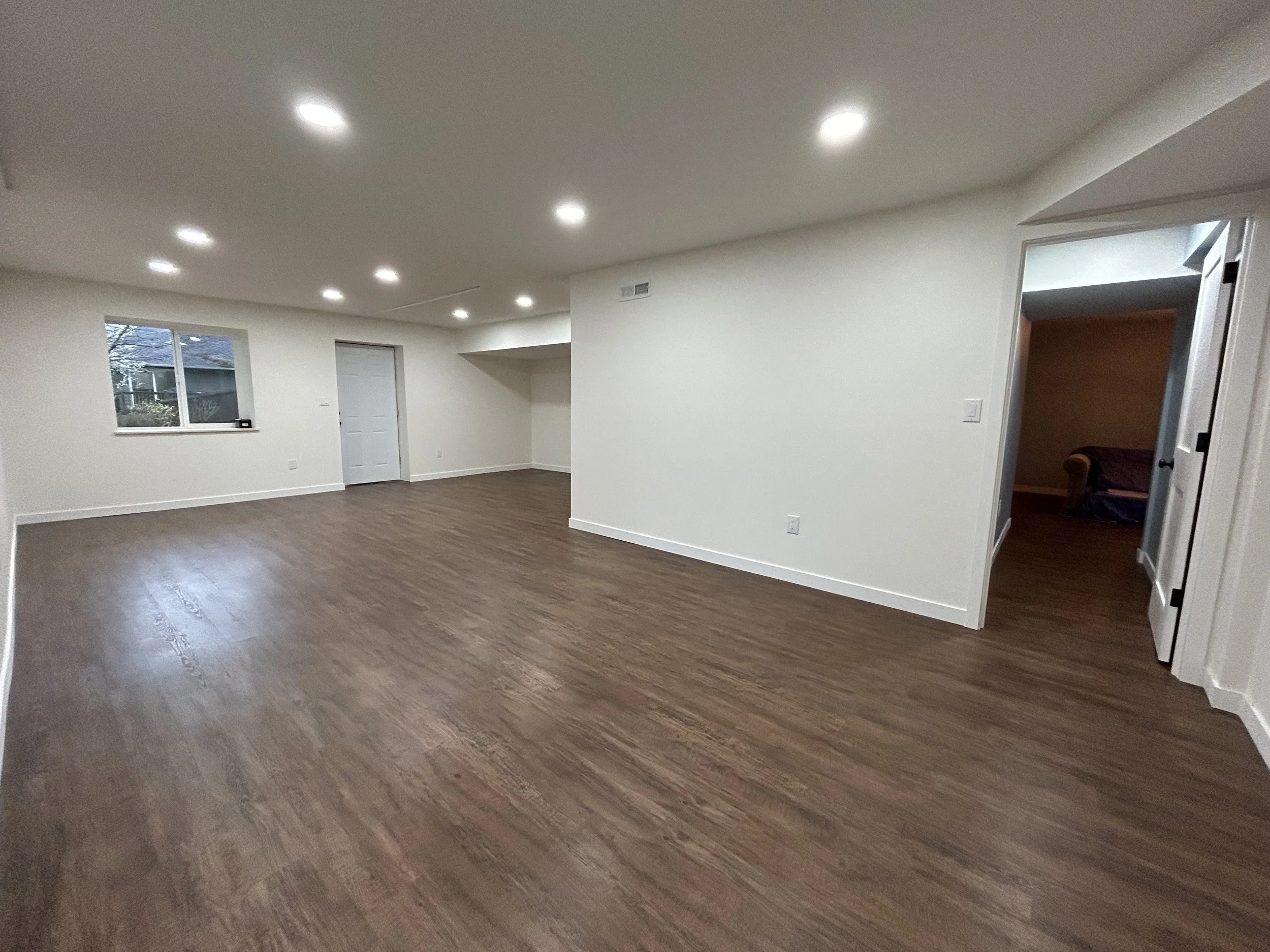 Finished Lynnwood basement with drywall installation, smooth wall finishing, and professional interior painting