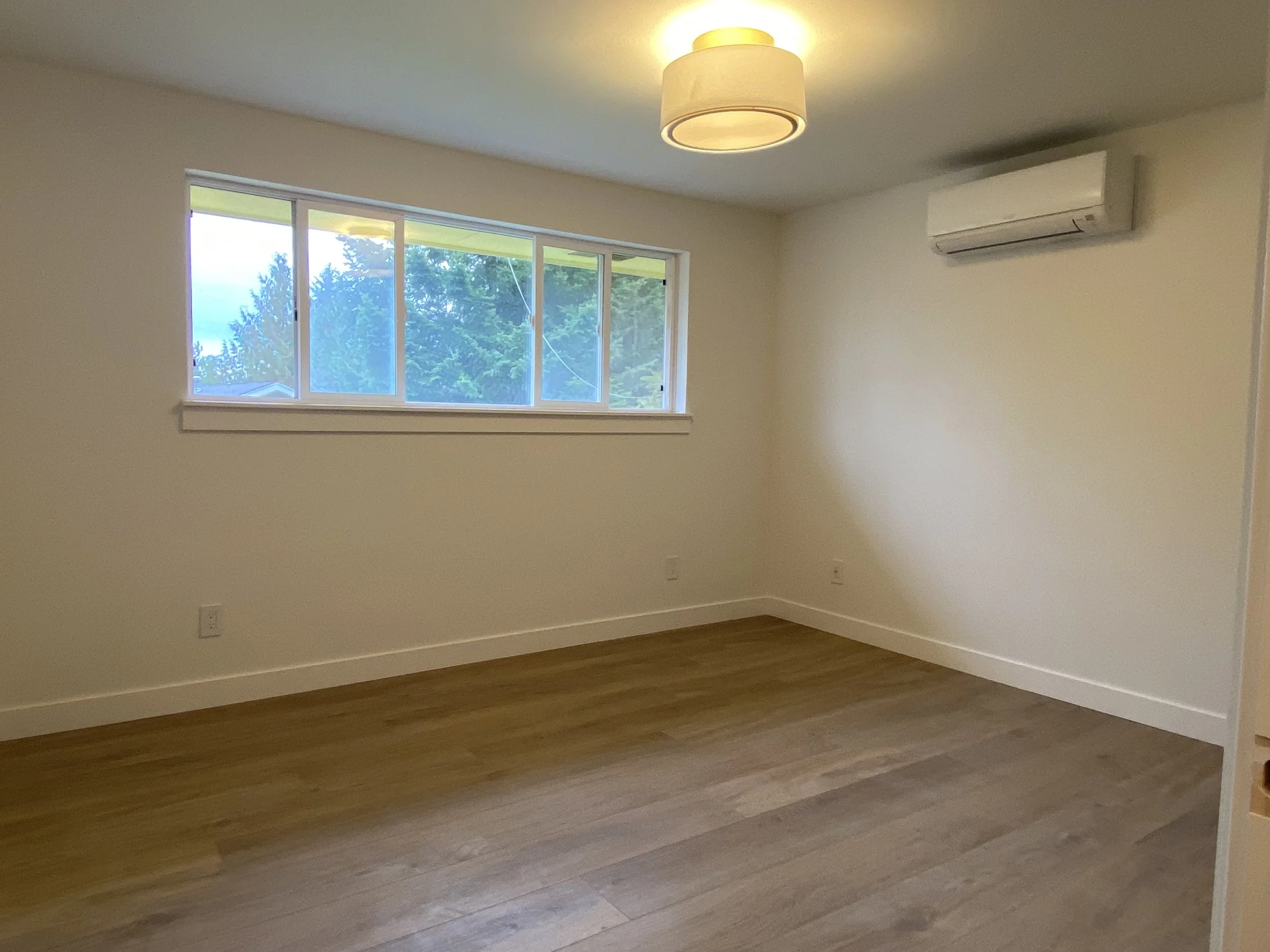 After drywall repair in Redmond WA with smooth walls and finished interior painting.