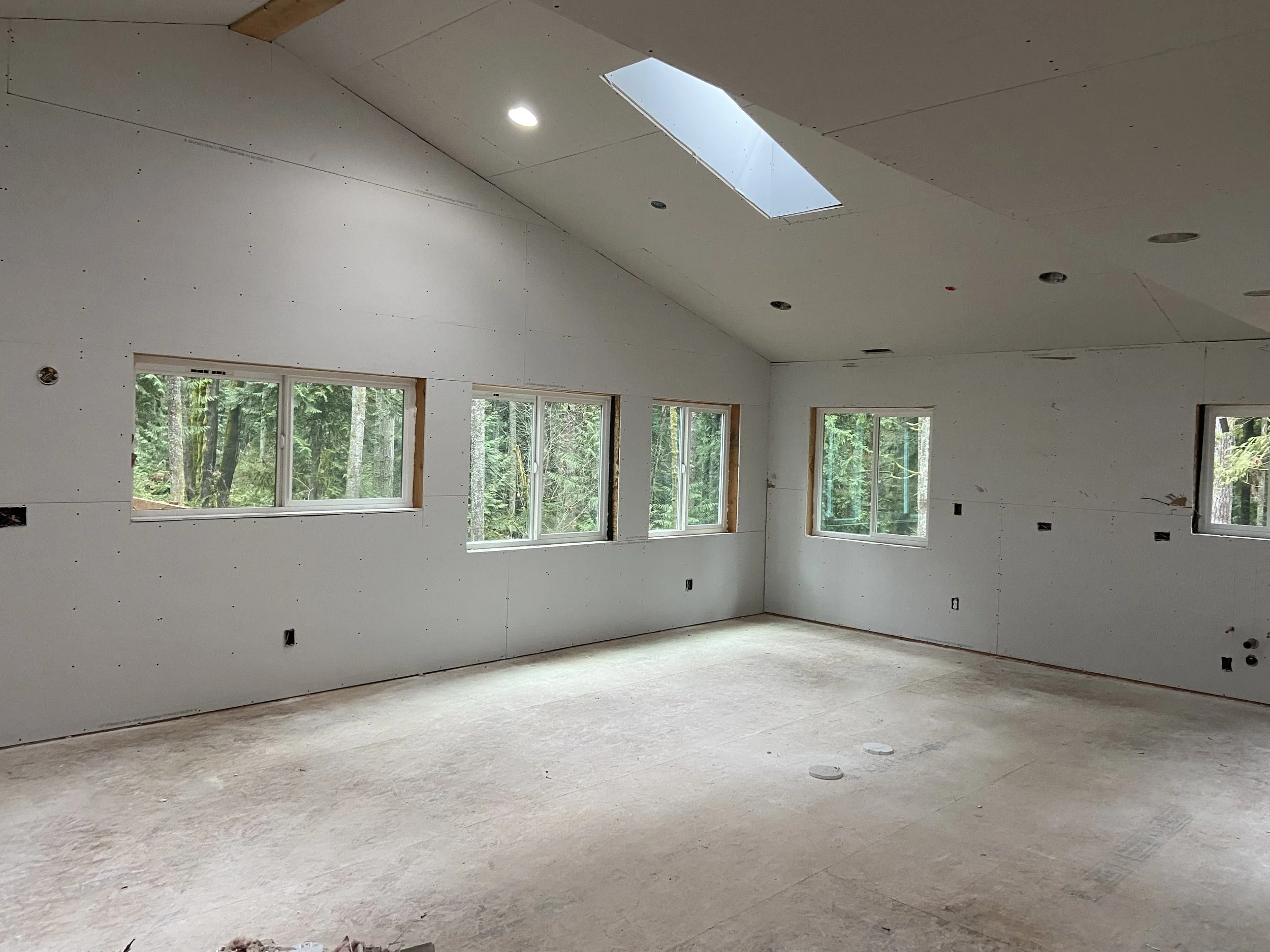 Level 0 drywall finish with unfinished drywall panels prior to taping and finishing