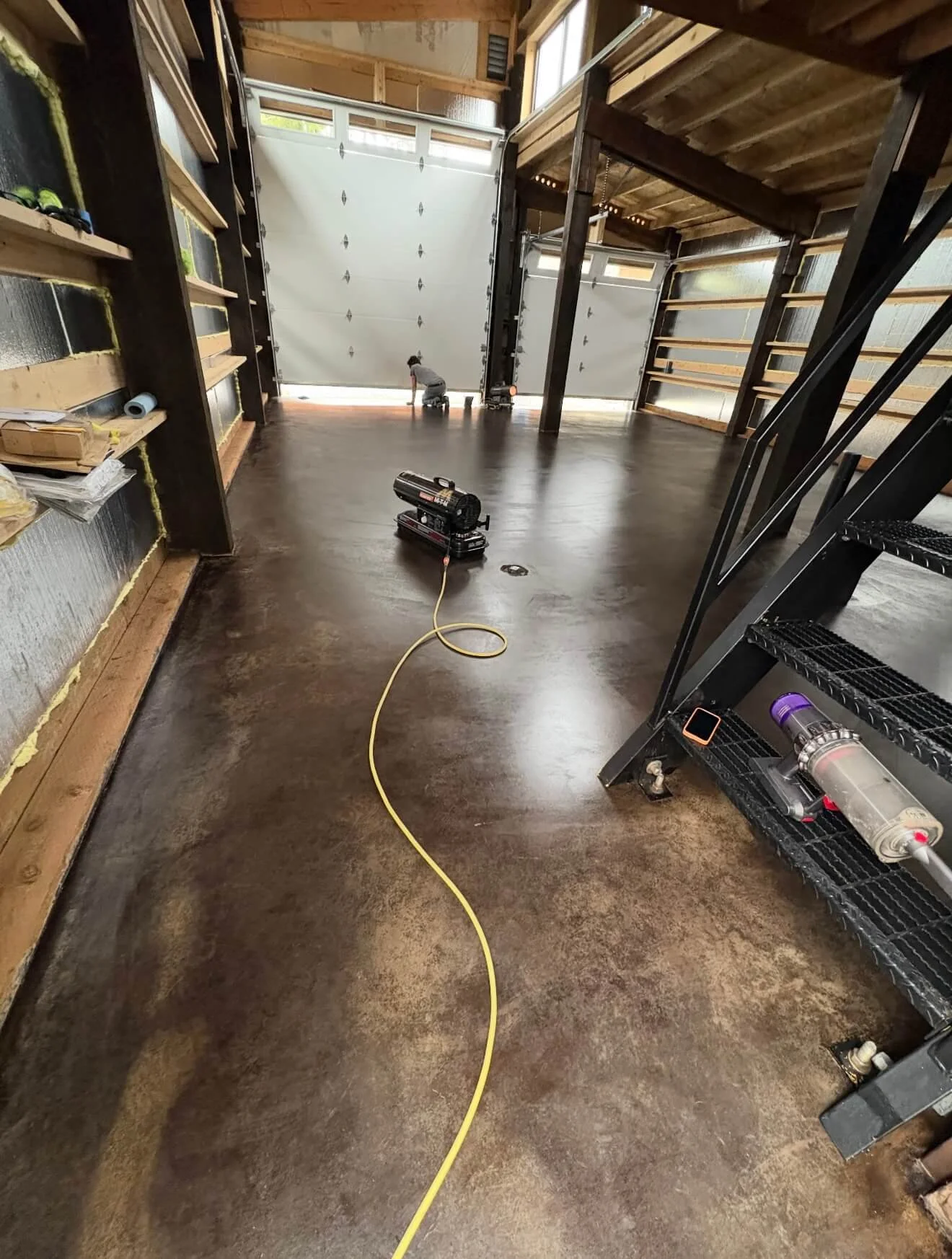 Seattle garage with exposed framing and insulation before drywall installation
