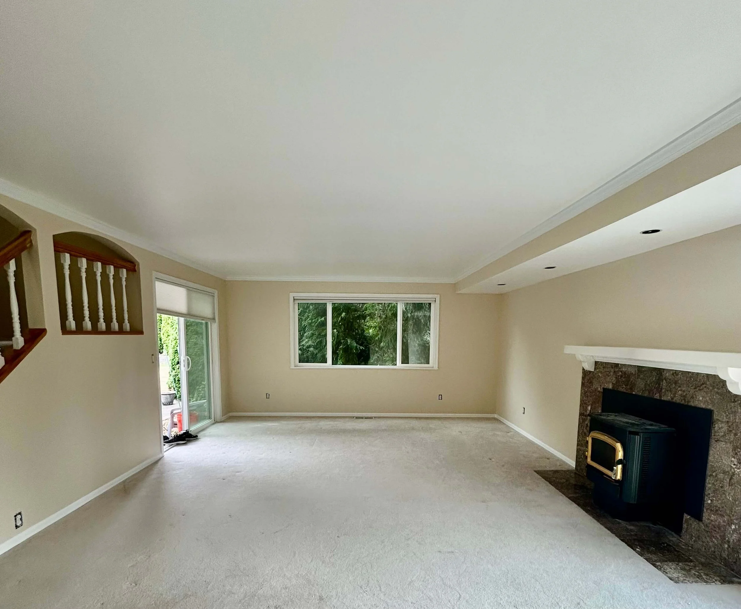Bellevue living room after popcorn ceiling removal with smooth ceiling, refinished walls, and interior painting