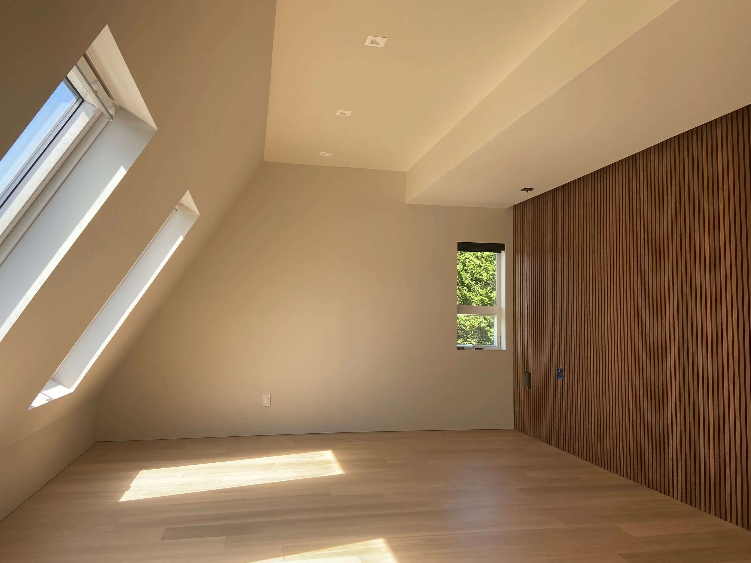 Redmond interior after Level 5 skim coating with smooth walls, recessed lighting, and strong natural light