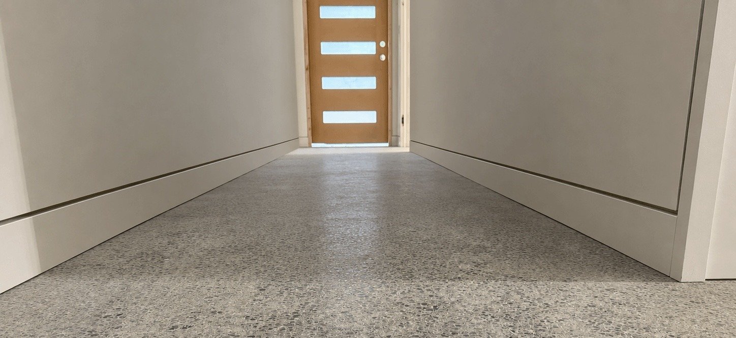 Redmond hallway with smooth Level 5 drywall walls and recessed baseboards separated by continuous shadow reveal reglets.