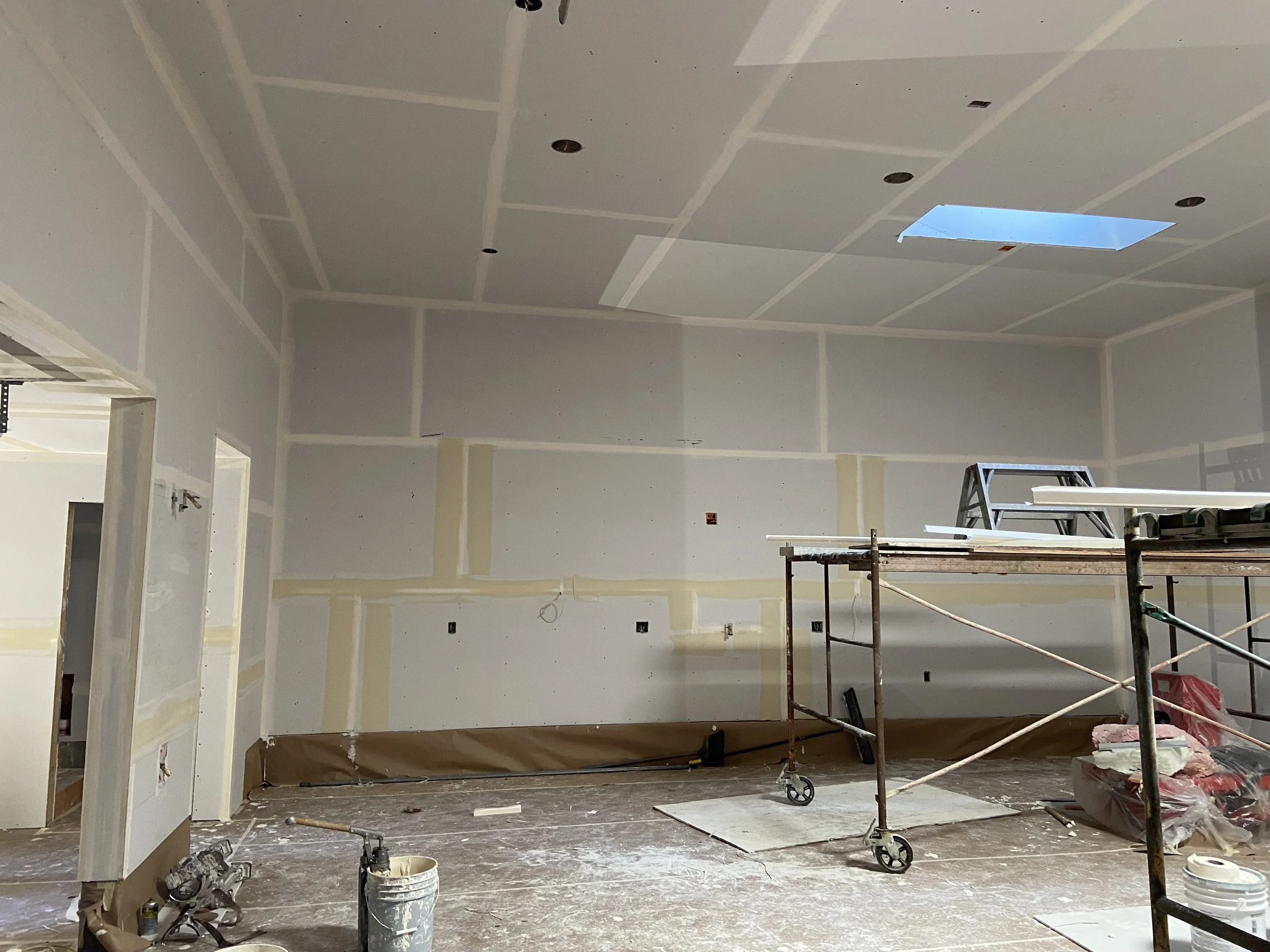 Level 2 drywall finish with taped joints and additional coat of compound for utility spaces