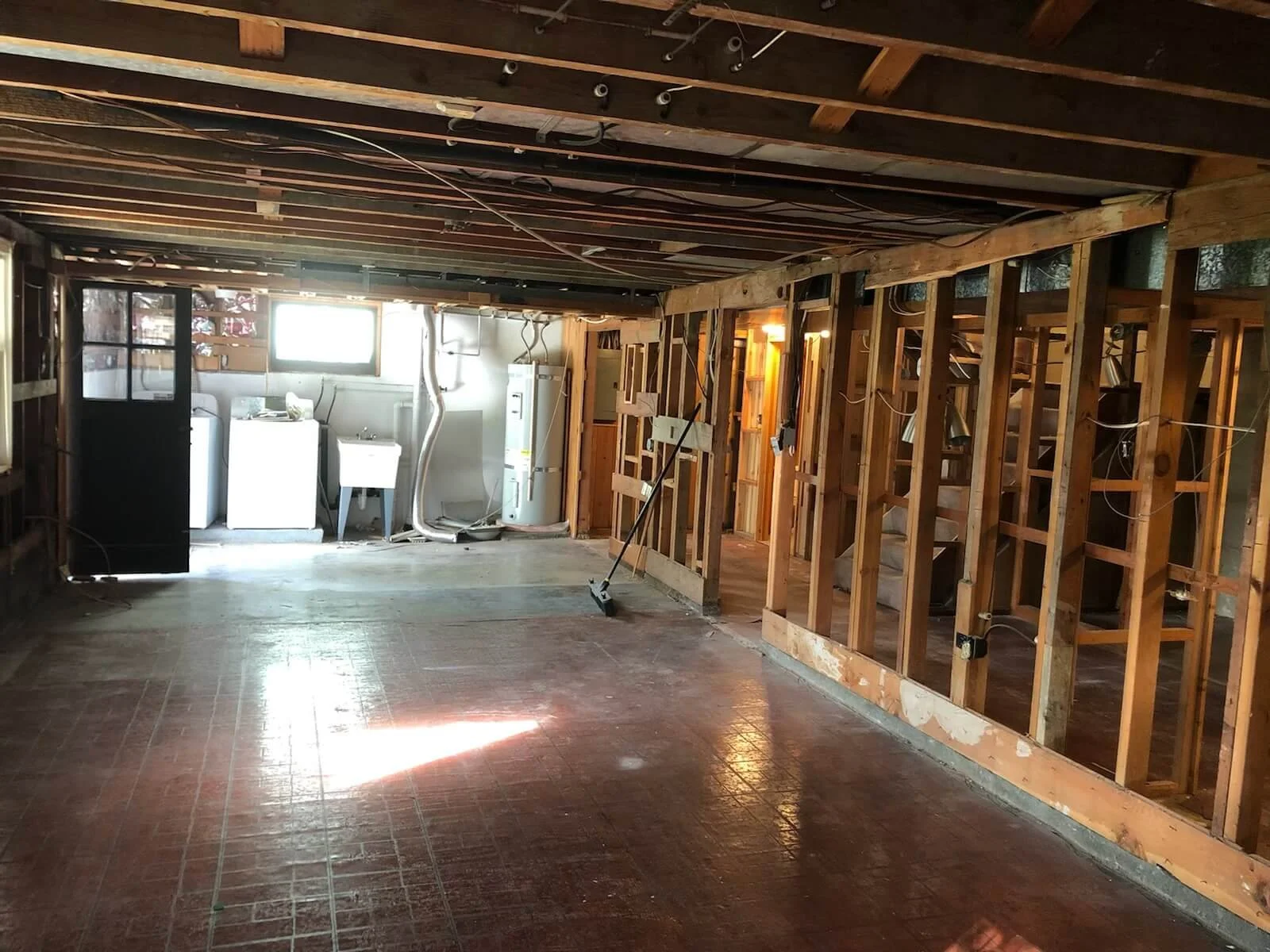 Basement demolition and drywall-ready preparation including framing corrections and wall prep