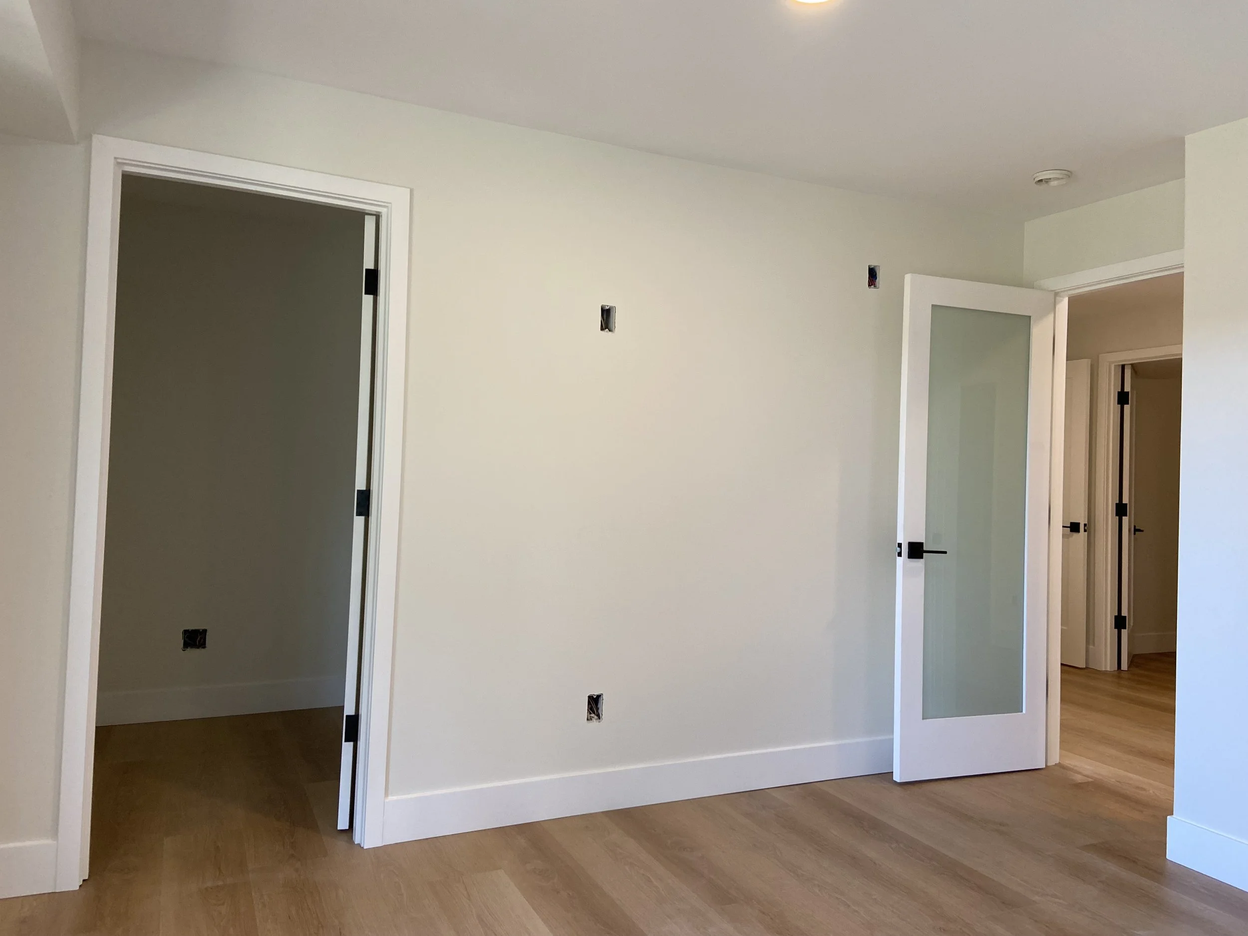 Finished Kenmore basement with premium drywall finishing, smooth walls, and interior painting