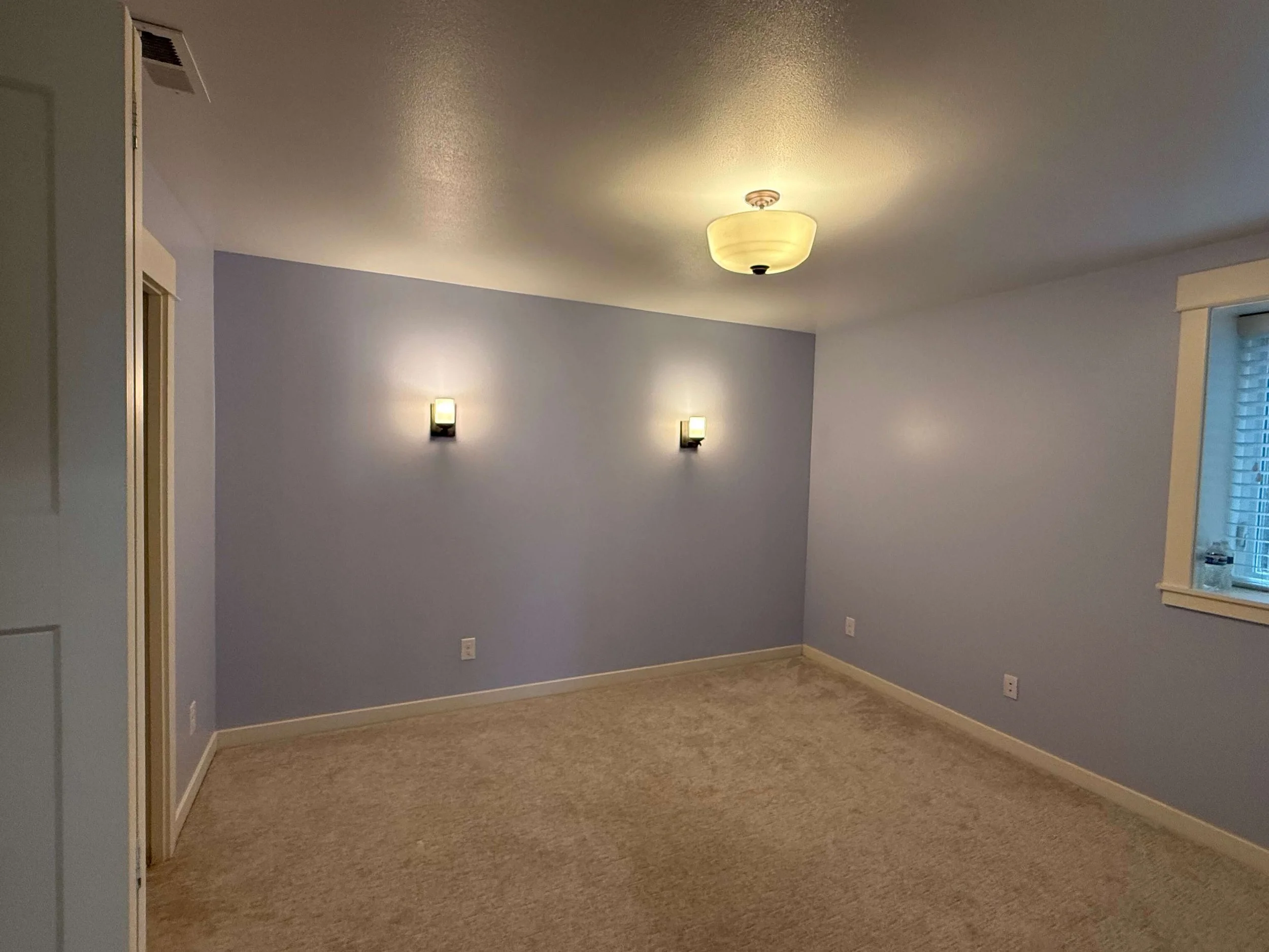 After drywall repair in a Kirkland WA basement with Level 4 smooth finish and professional interior painting.