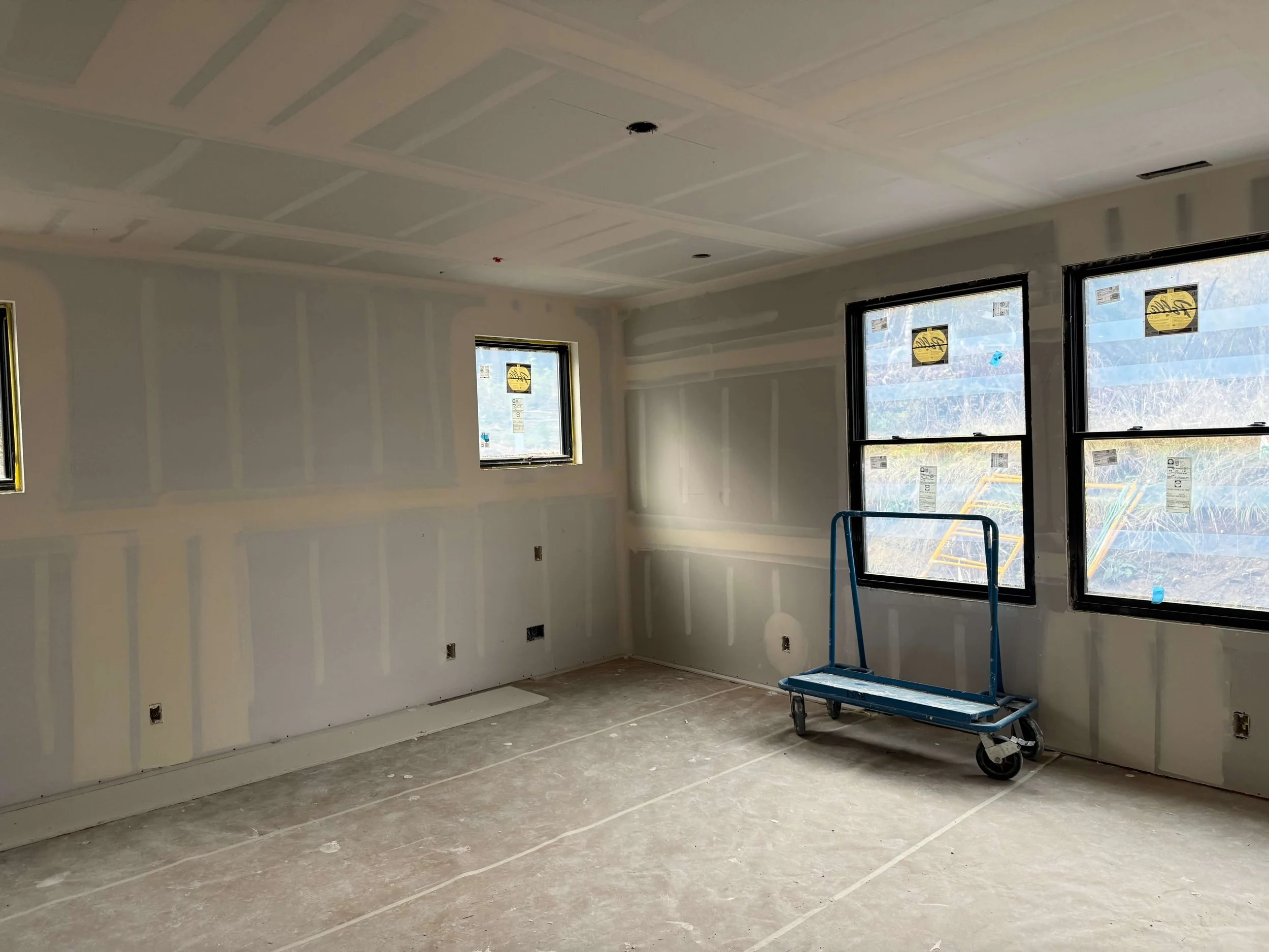 New drywall installation before primer and interior painting in Duvall WA custom home