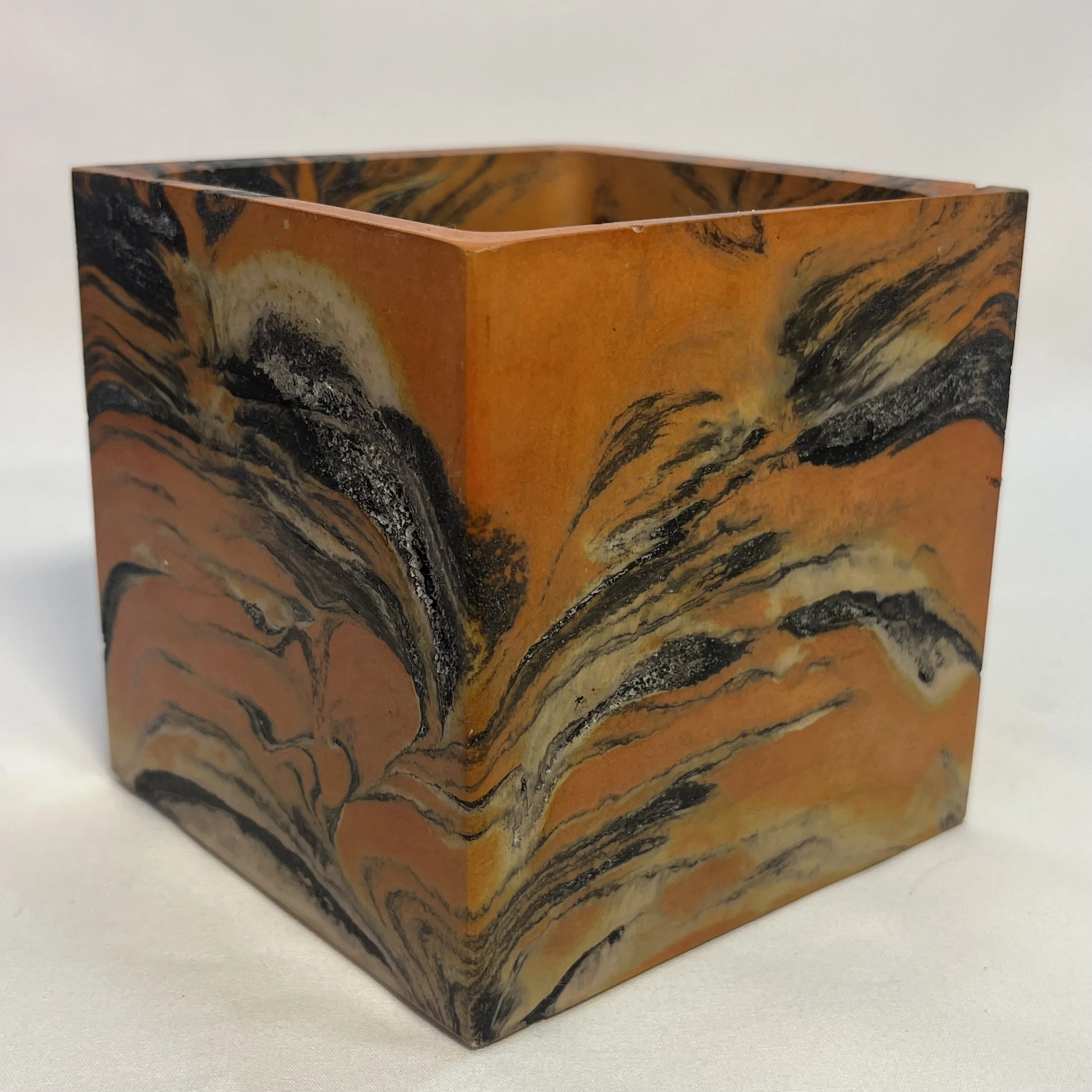 marbled orange concrete cube planter