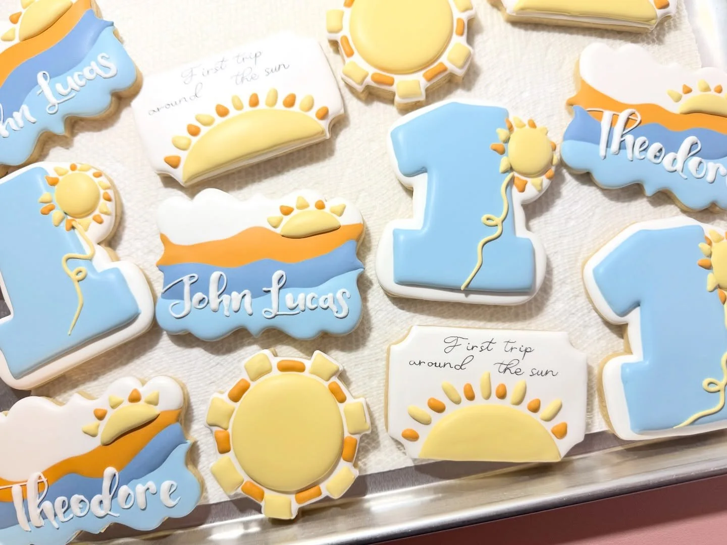 Turning one has never looked so sweet ☀️ Celebrating his first trip around the sun with the cutest custom decorated cookies for a very special first birthday! 
.
.
#FirstTripAroundTheSun #FirstBirthday #CustomCookies #DecoratedCookies #cookieart