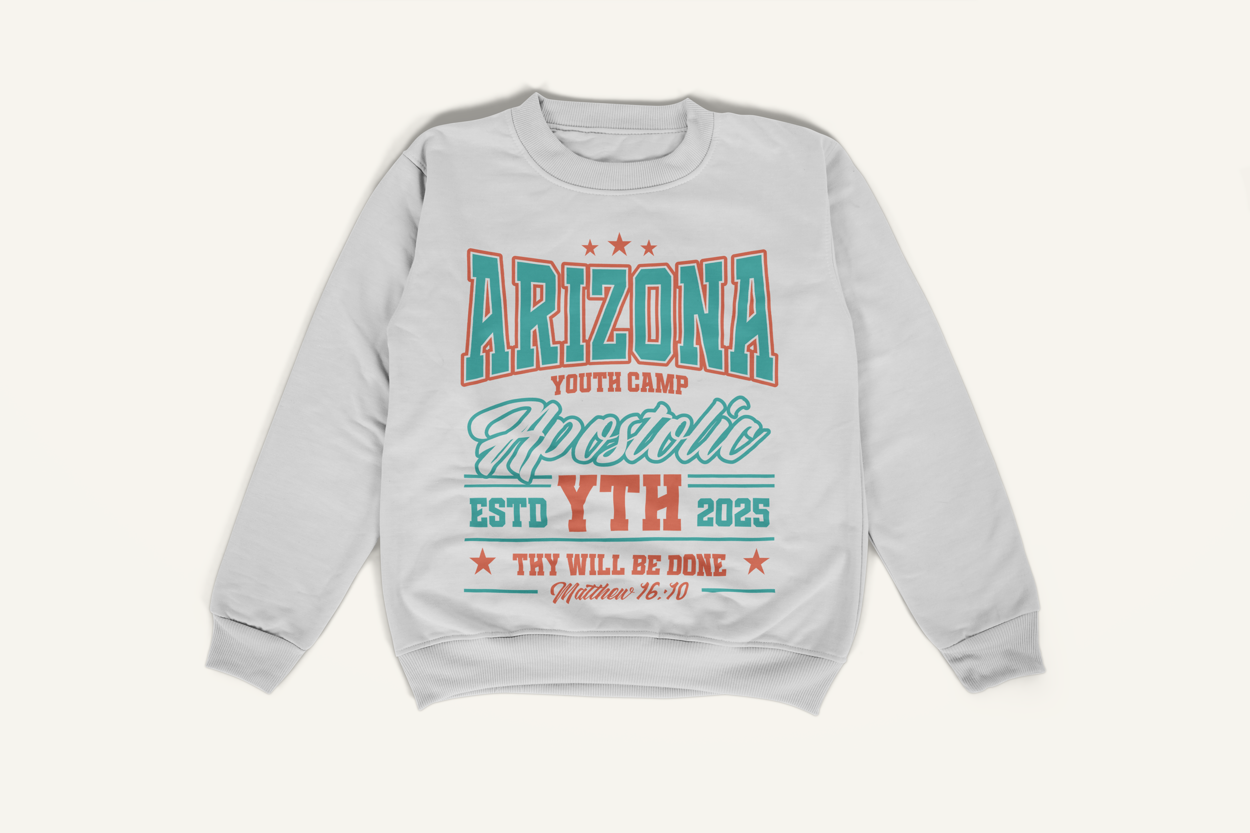 Gray sweatshirt with colorful text and design promoting Arizona youth camp, featuring references to Matthew 16:10 and 2025.