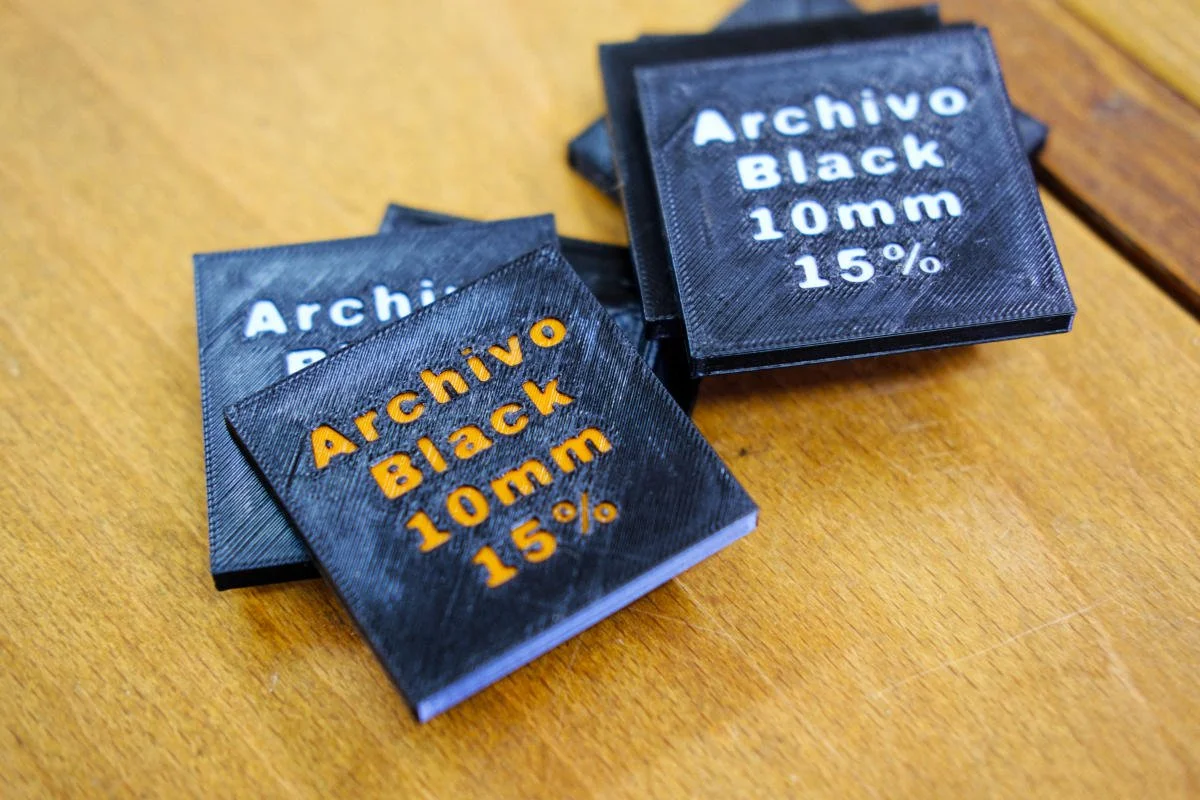 PETG 3D printed discs showing settings for printing lettering.