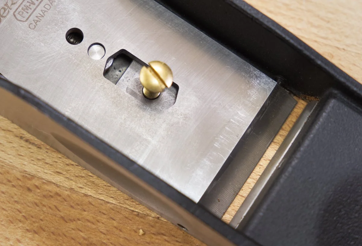 The blade of a Veritas Low Angle Jack hand plane installed into the body and showing the bevel up configuration.