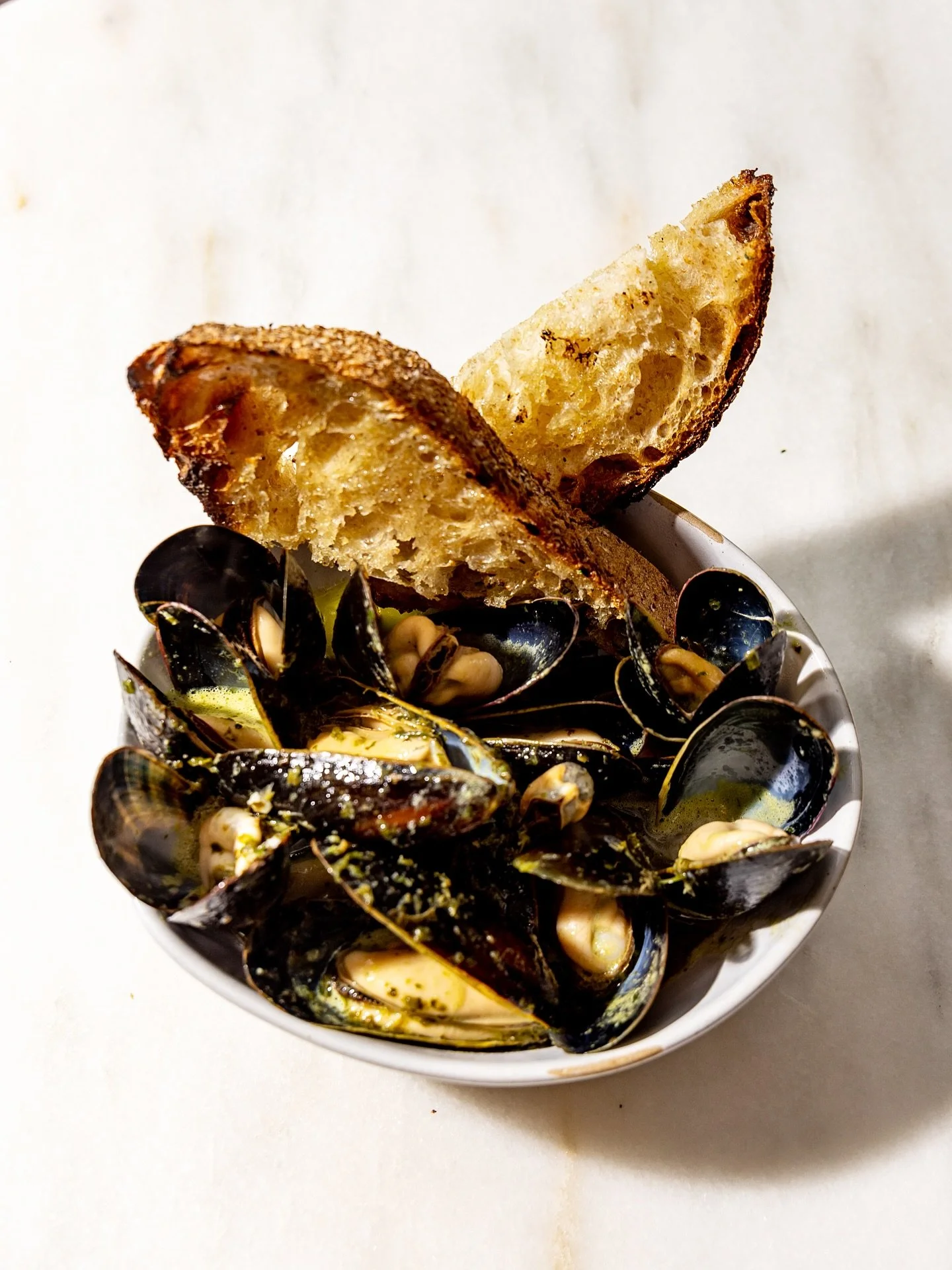 COZZE, Bang Island Maine mussels, green garlic butter, and grilled bread.