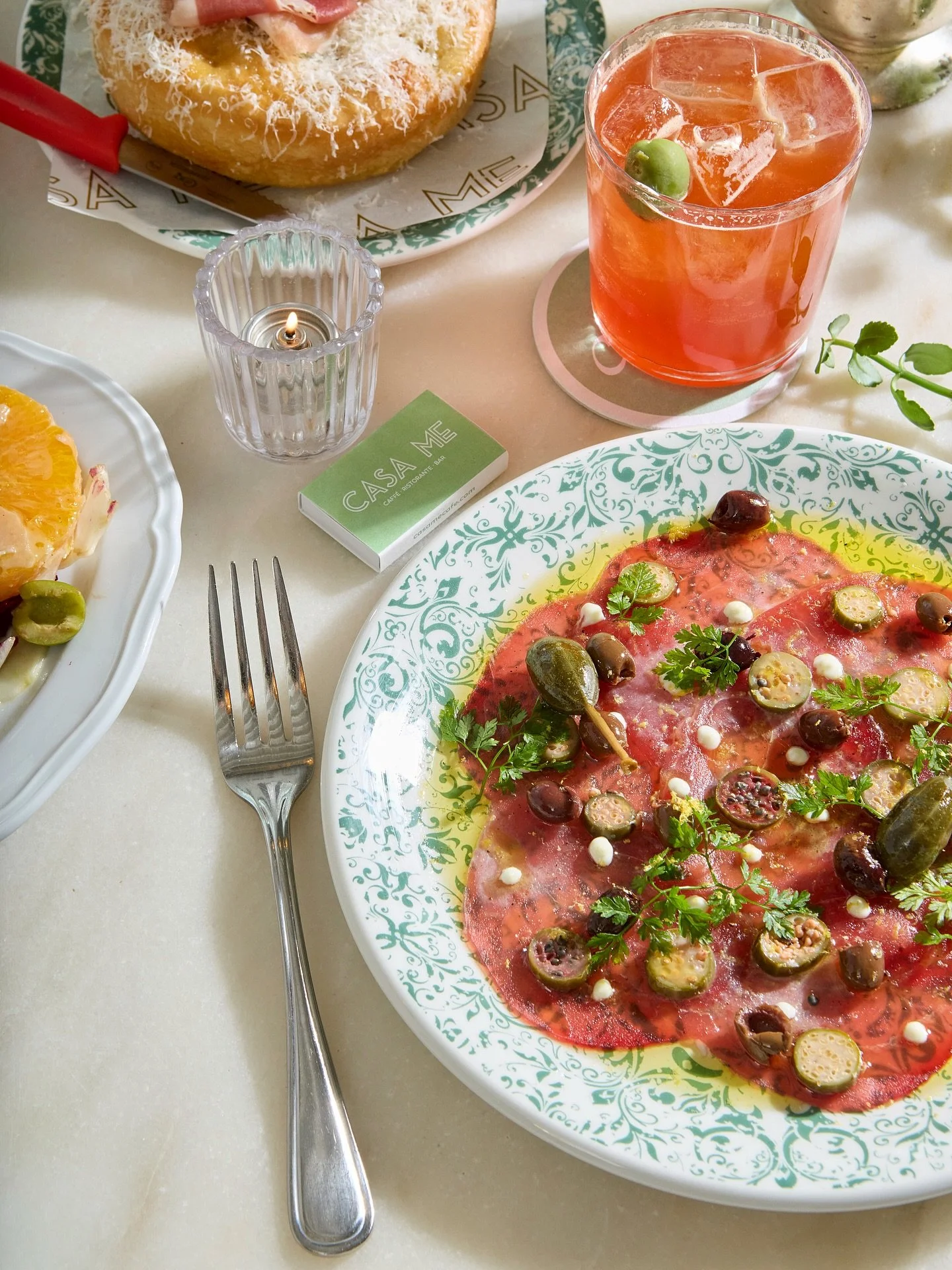 The perfect way to start any meal. CARPACCIO DI TONNO, yellowfin tuna crudo, caperberries, taggiasca olives, lemon zest, and aioli.