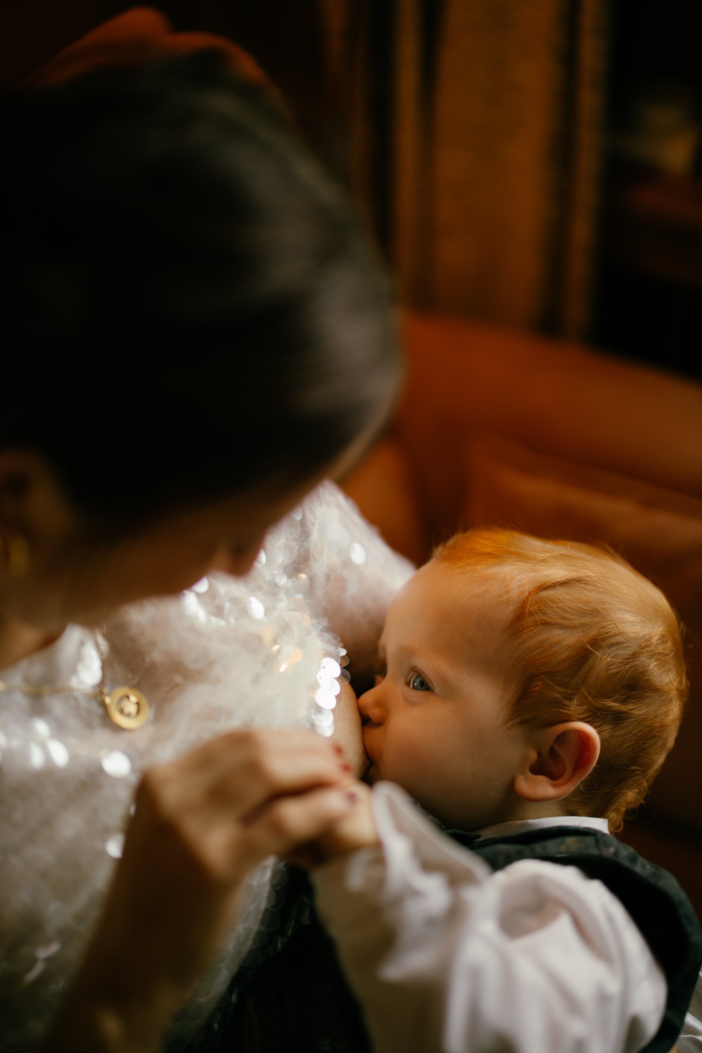 Son's bride breastfeeding. Wedding photographer.jpg