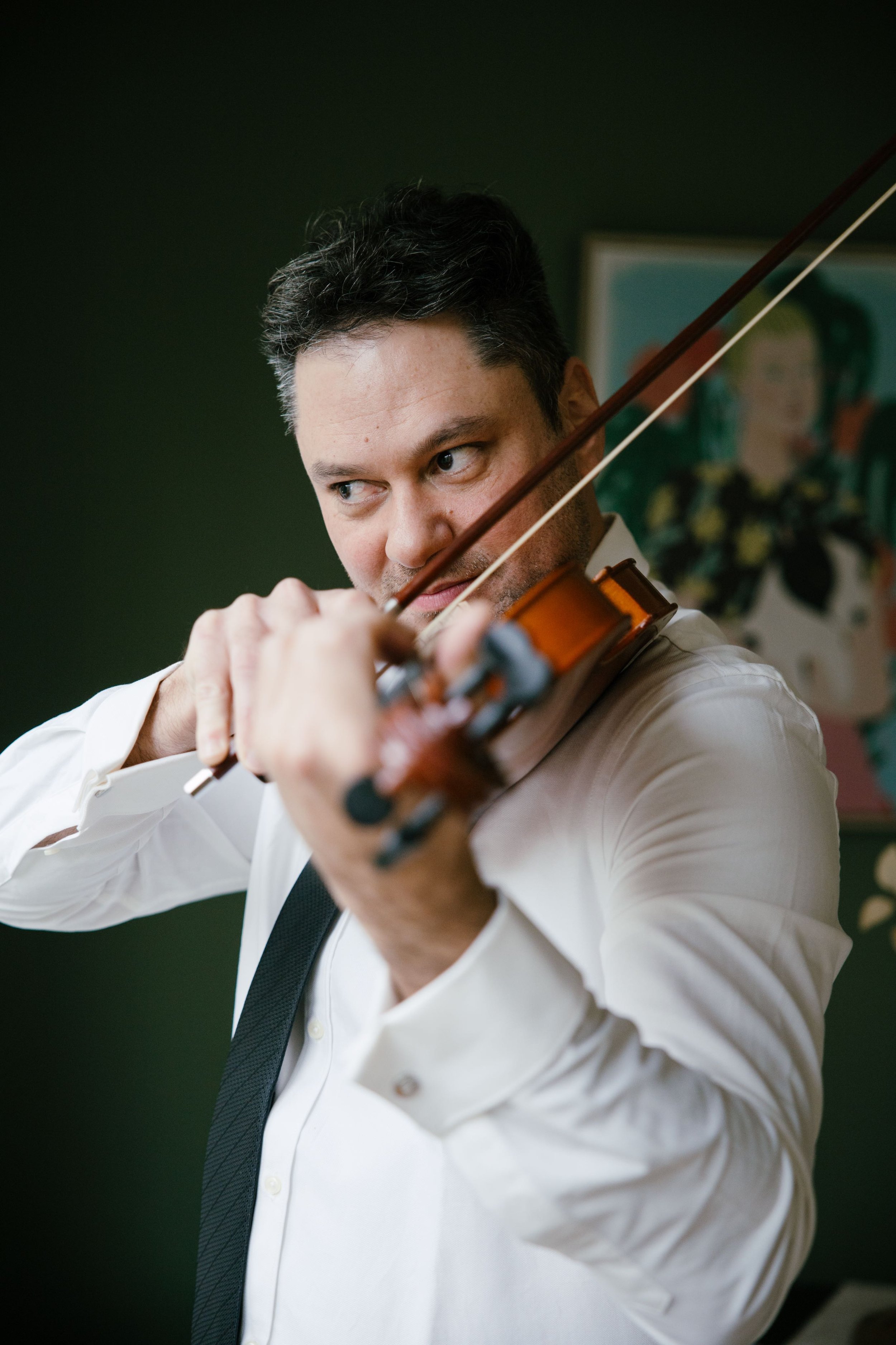 Groom playing violin.jpg