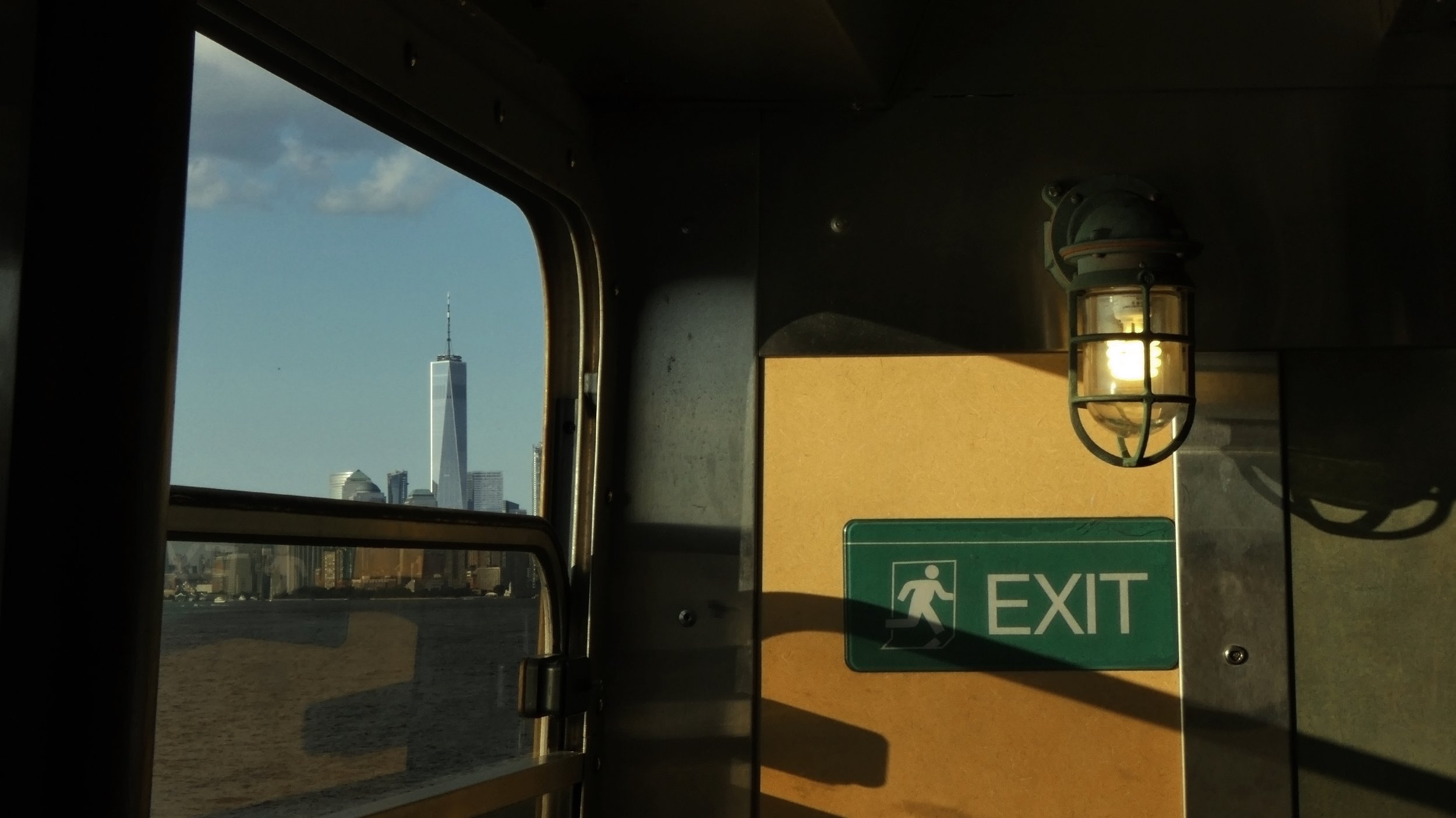 Staten Island Ferry Window and Freedom Tower.jpg