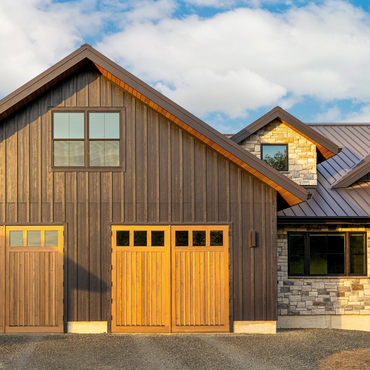 The exterior of Tall Timbers had so many custom elements - these garage doors were made by the project manager and turned out so beautiful! We love working with skilled craftsman and we couldn't do it without them. @ulrichbrosconstruction