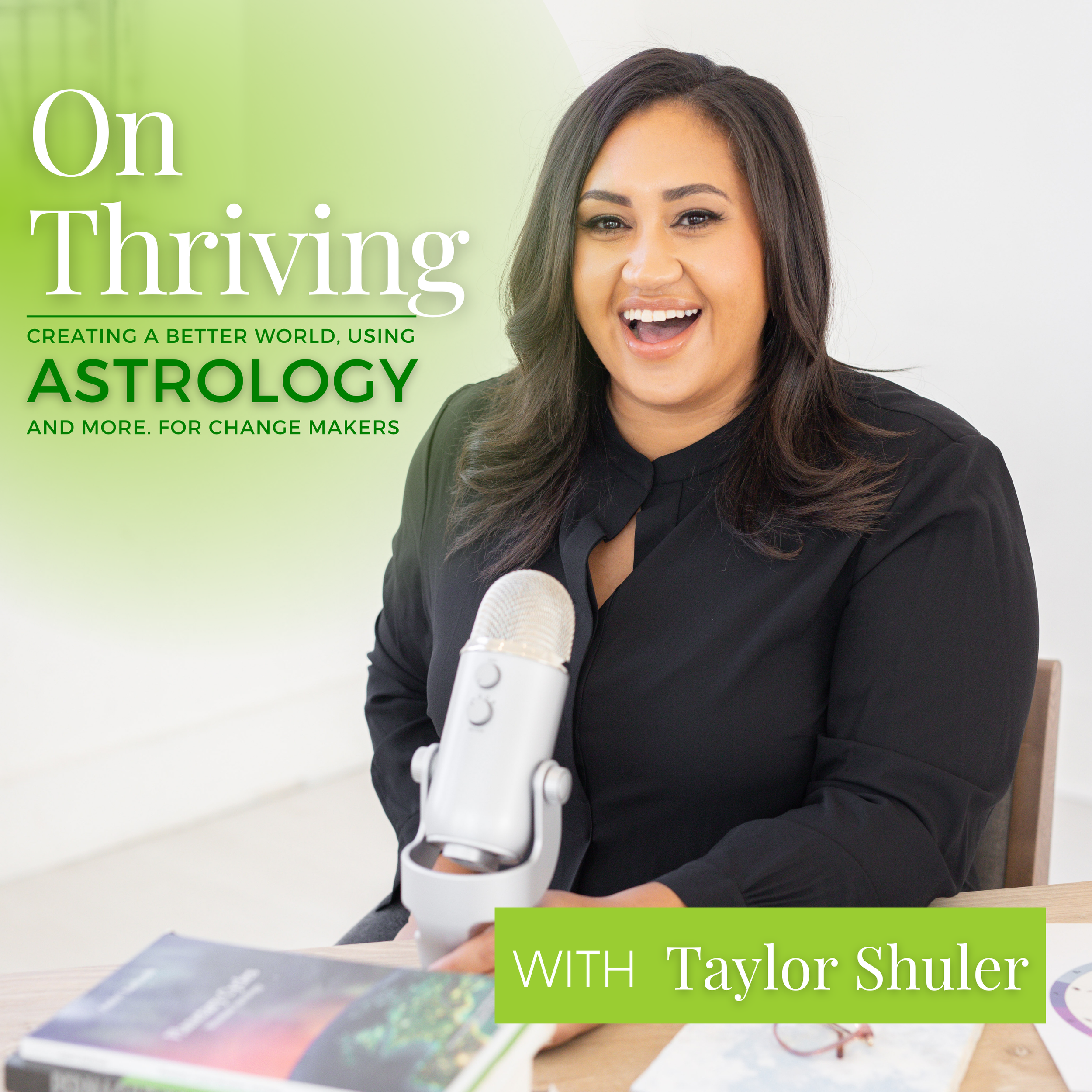On Thriving Podcast Cover featuring Taylor in a black long sleeve blouse with a silver microphone and astrology books on a desk