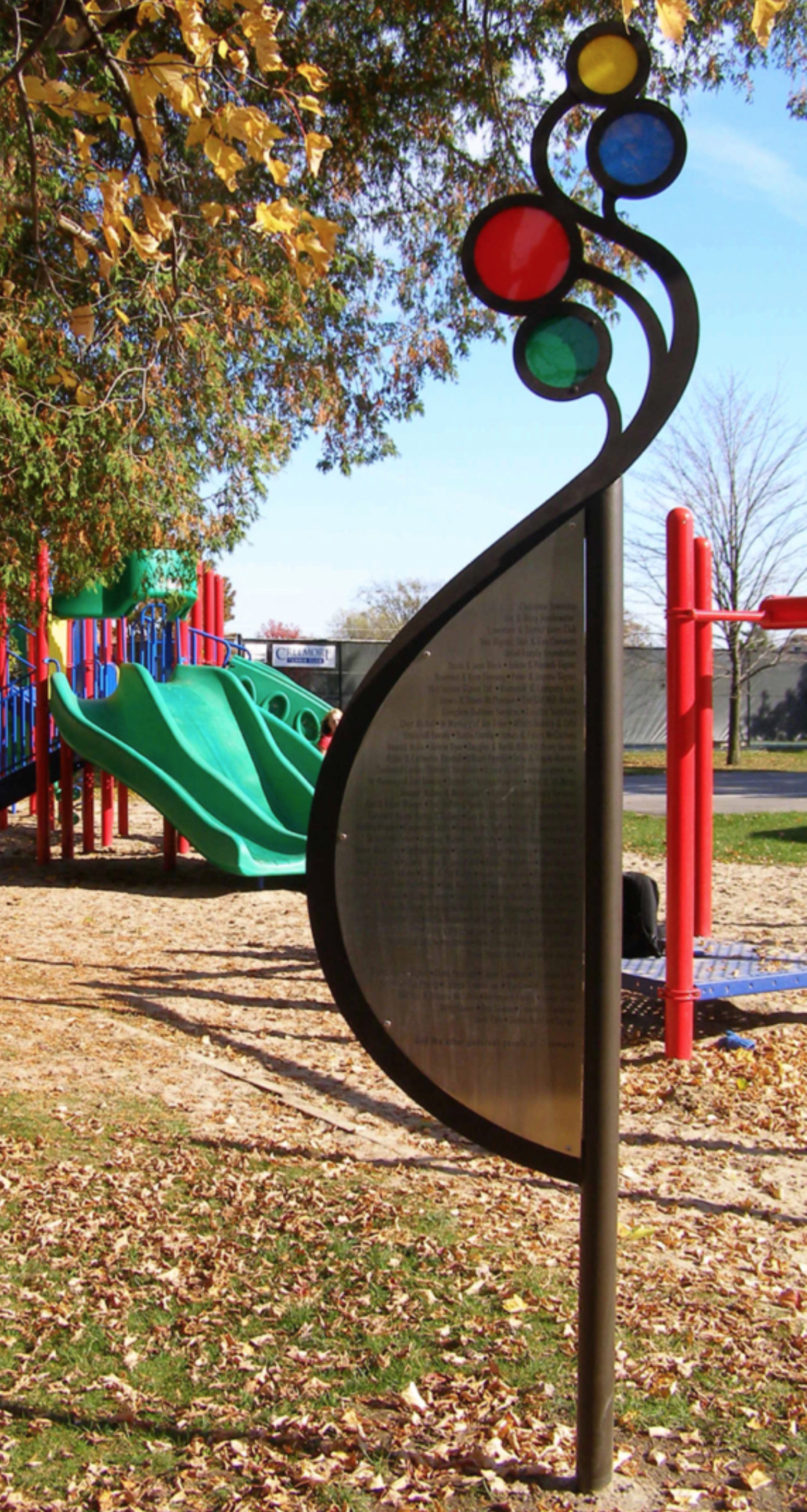 Donor plaque honouring contributors to a children’s playground. The design reflects the shapes and colours of the equipment while evoking the curve of an expectant mother and the playful movement of released balloons. Crafted in laser-etched stainles