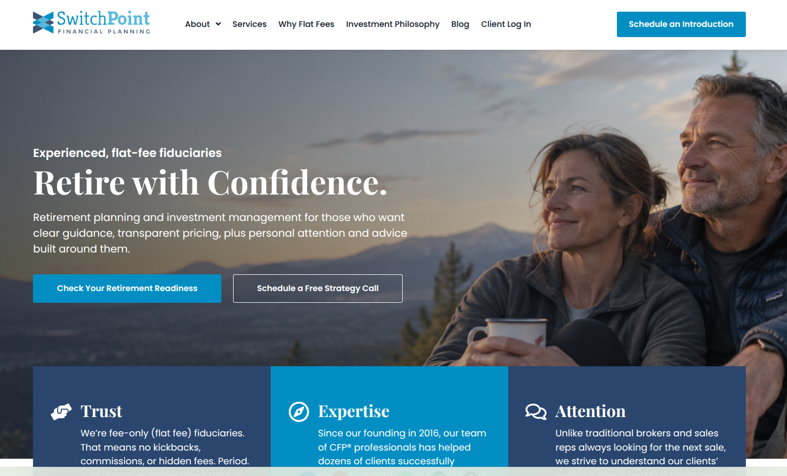 Homepage of SwitchPoint Financial Planning website featuring a man and woman embracing outdoors with a hilly landscape in the background. Text overlay highlights retirement planning and flat fee fiduciaries.