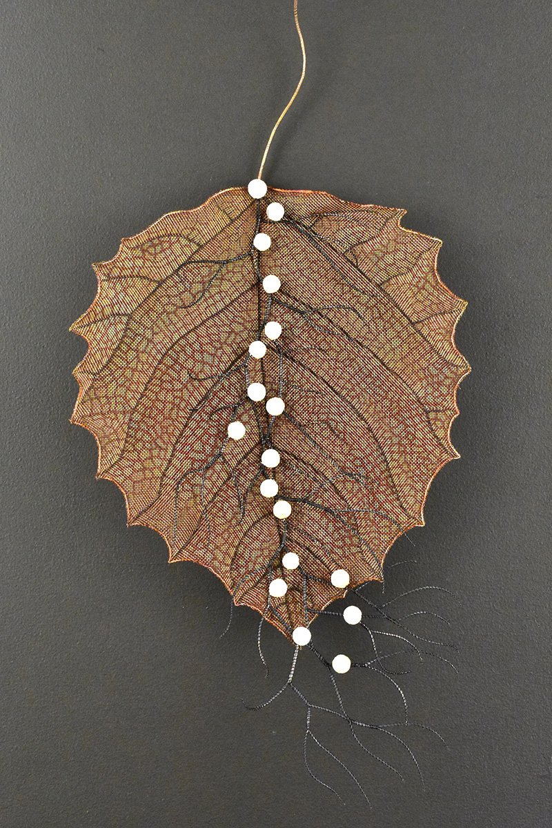 Snow Berries on Leaf, Copper mesh, glass frit, wire (24x11.5x3) $1,500