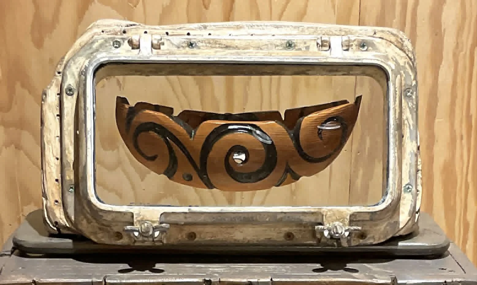 Steve Jensen - Floating Portal, 10" x 21" x 9" (boat) & 36"  x 22" x 12.5" (base), salvaged aluminum porthole, recycled cedar ship planks (boat) salvaged wooden planks (base), $6500