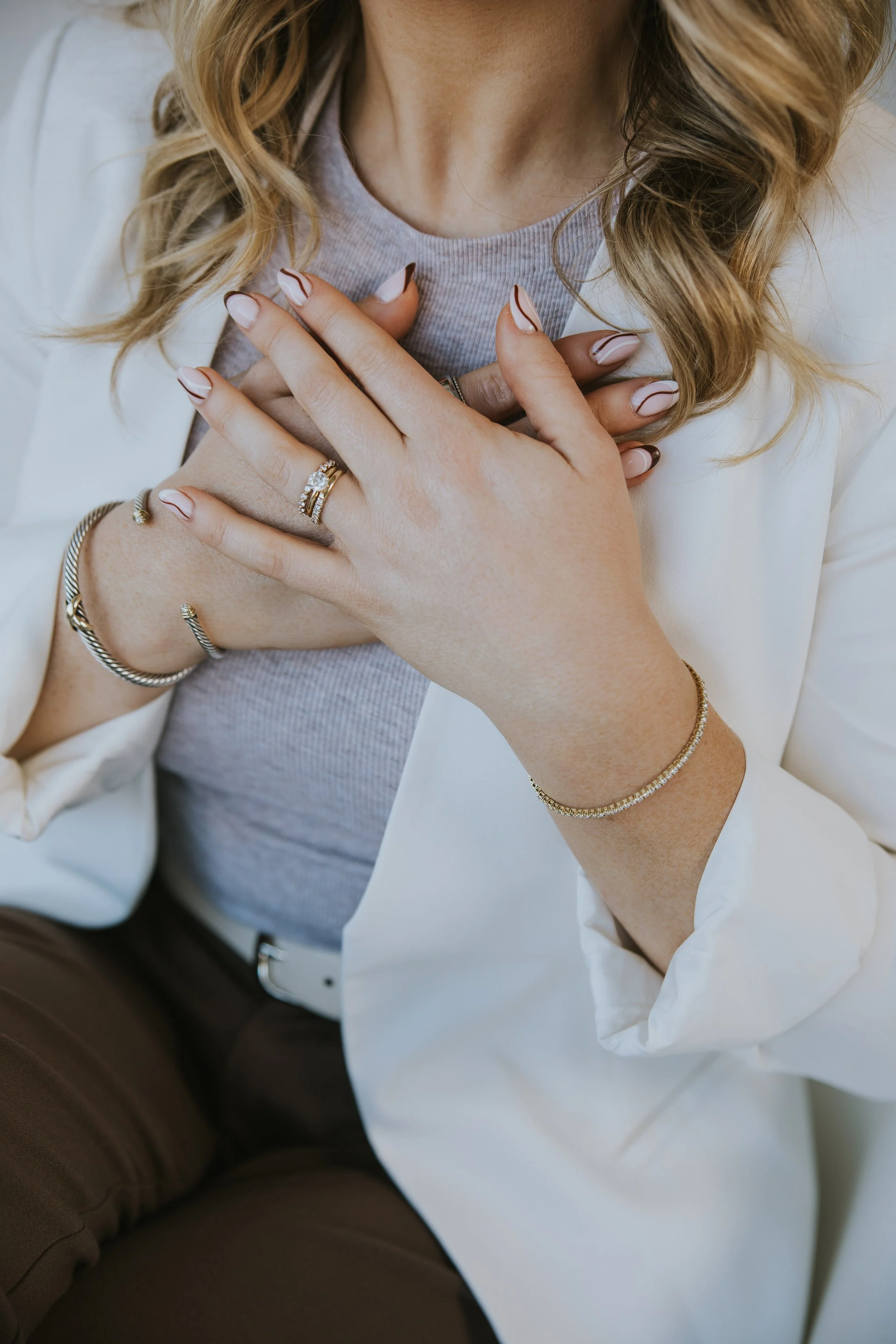 Woman with her hand on her chest, feeling calm and grounded