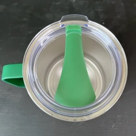 Close up of thermal mug lid closed