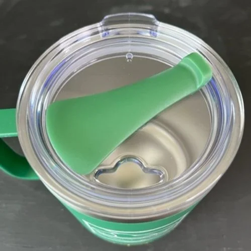 Close up of open thermal mug lid