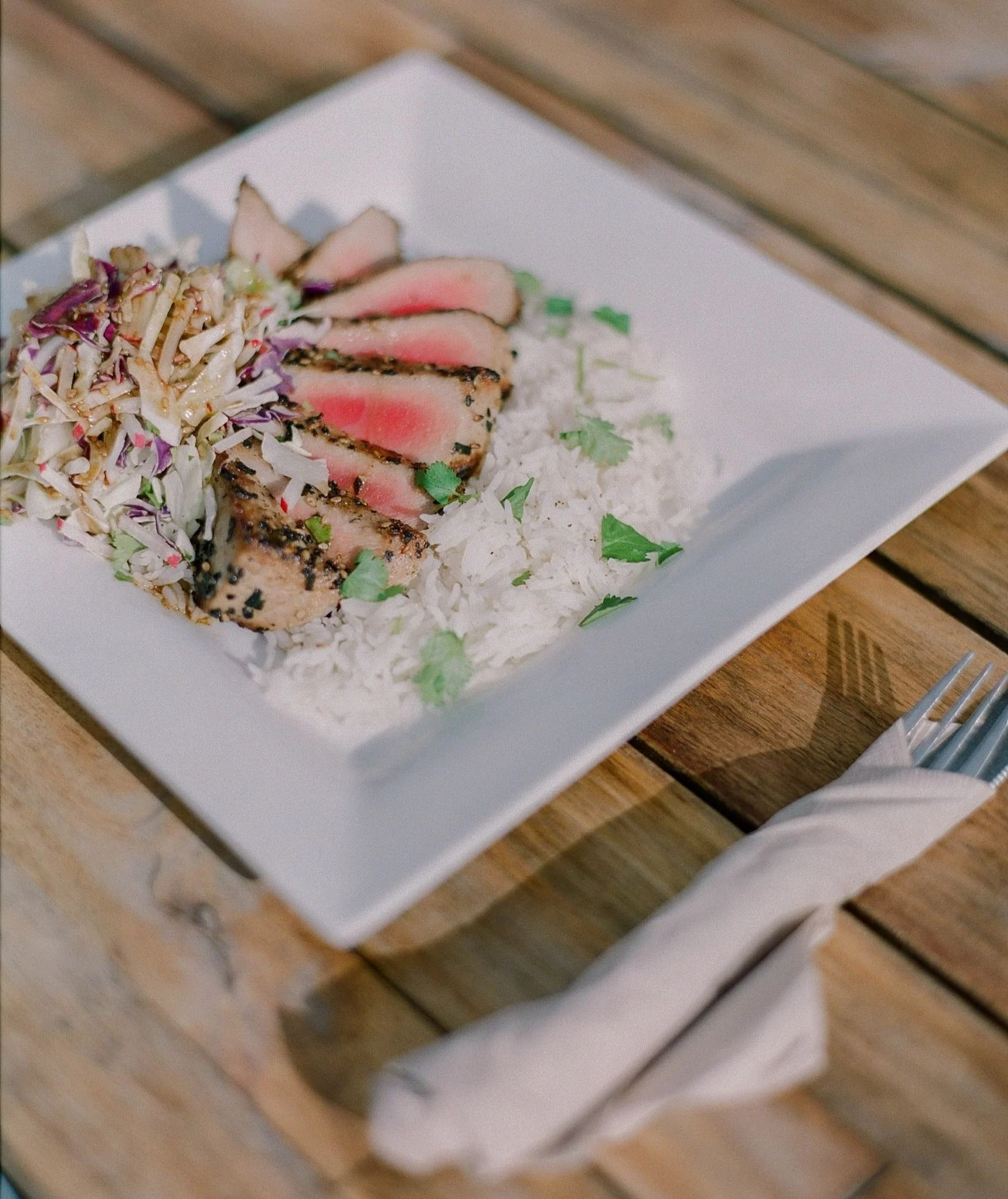 Seared ahi with cilantro rice on plate