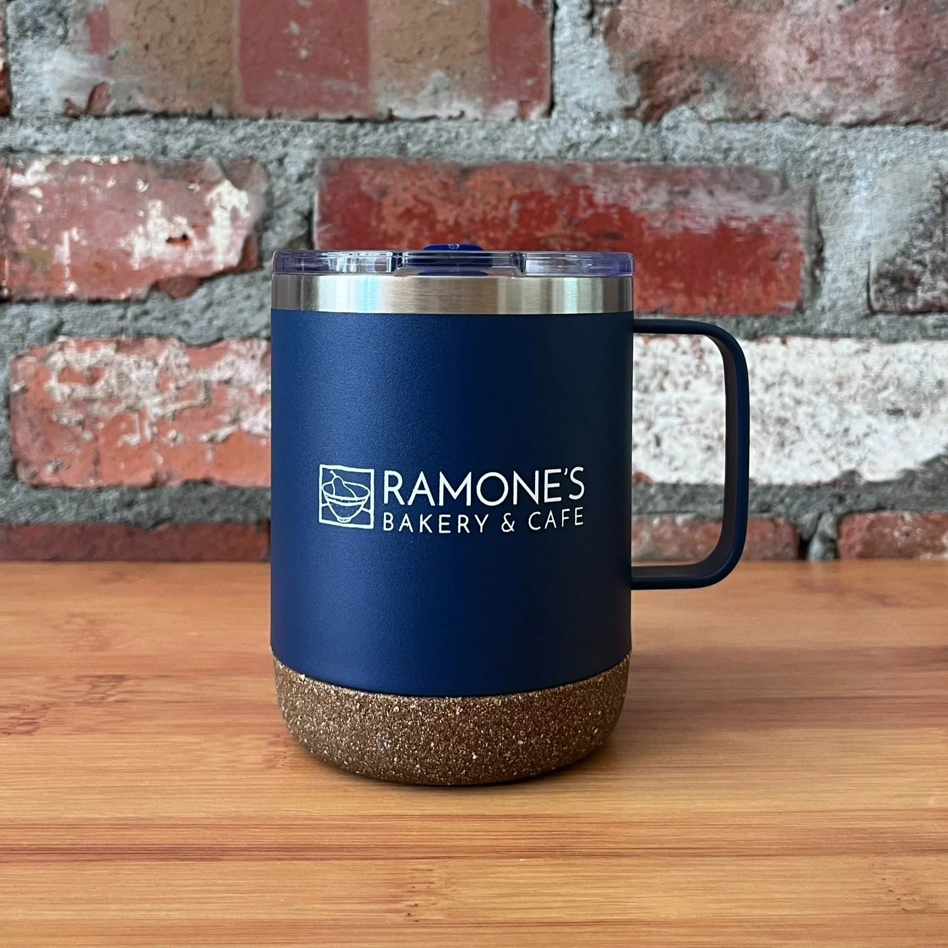 Back of navy thermal mug with Ramone's logo