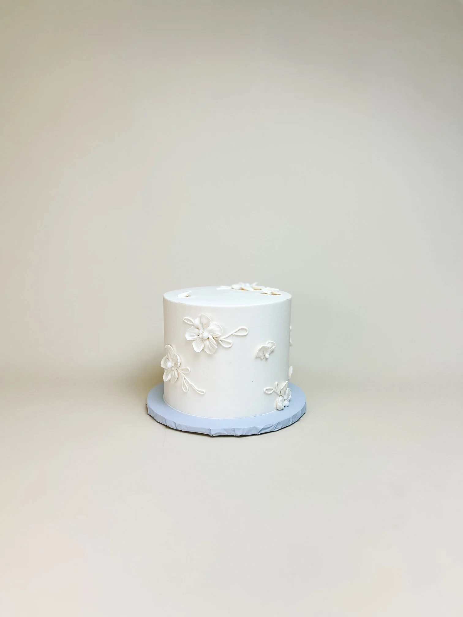 white painted floral cake