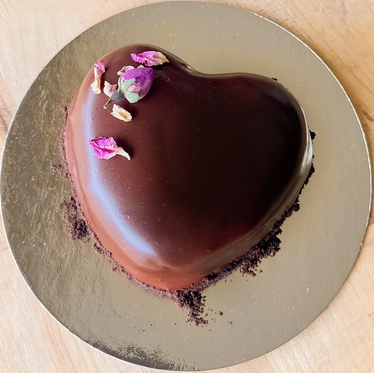 Heart-shaped chocolate cake with chocolate ganache frosting