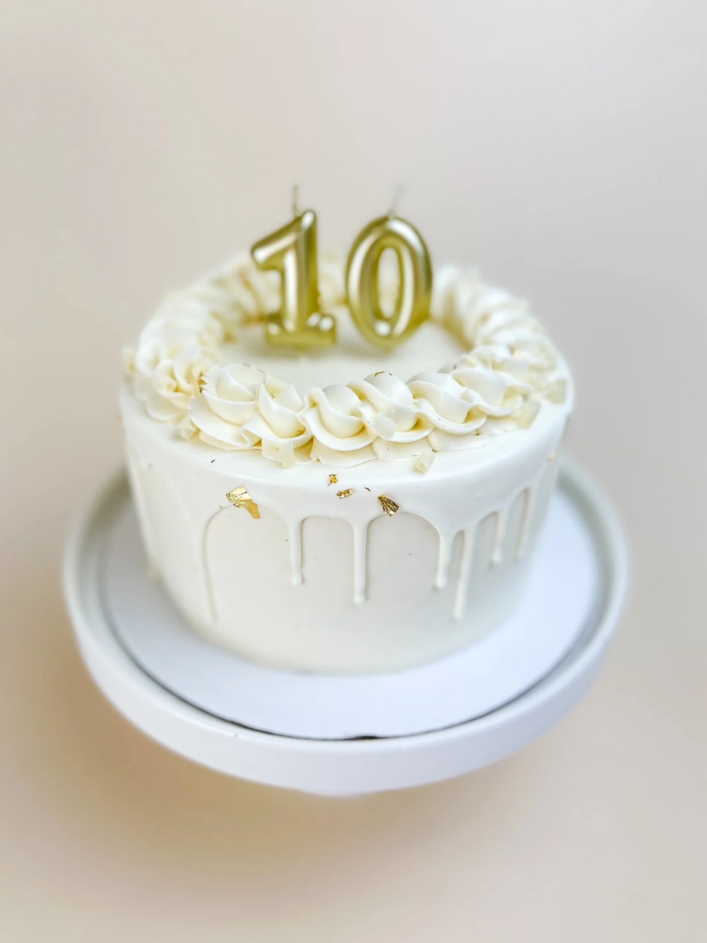 Elevated Vanilla Bean Cake with number candles