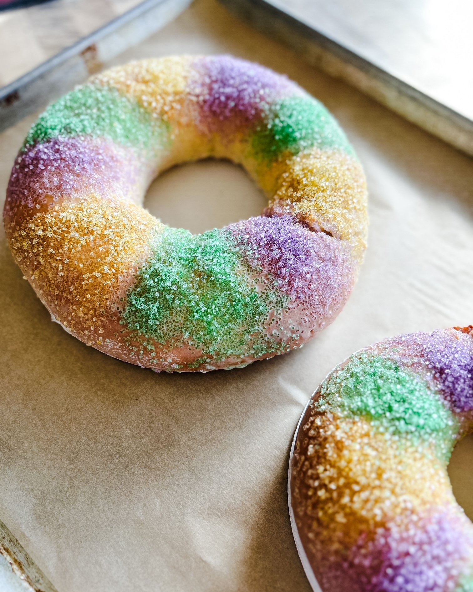 Colorful king cakes covered with rainbow-colored sugar crystals