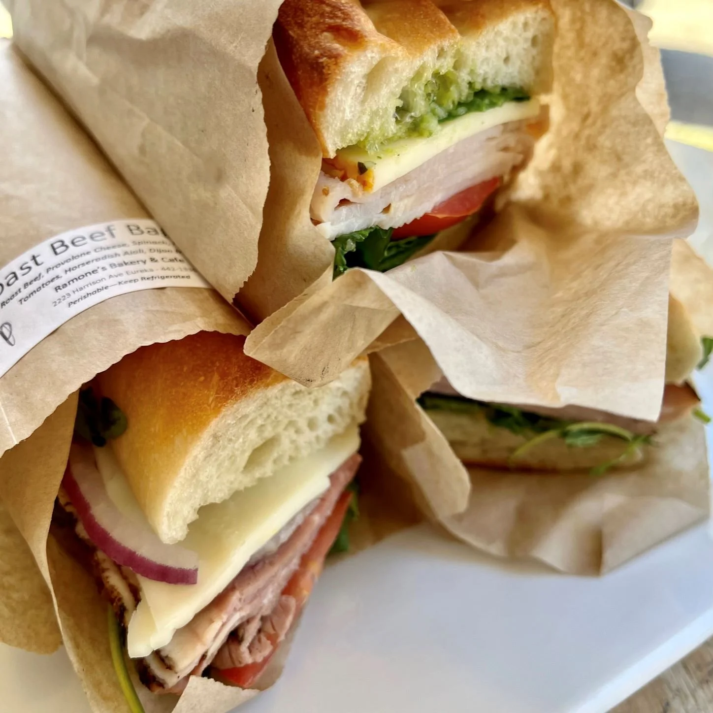 baguette sandwiches stacked on a platter