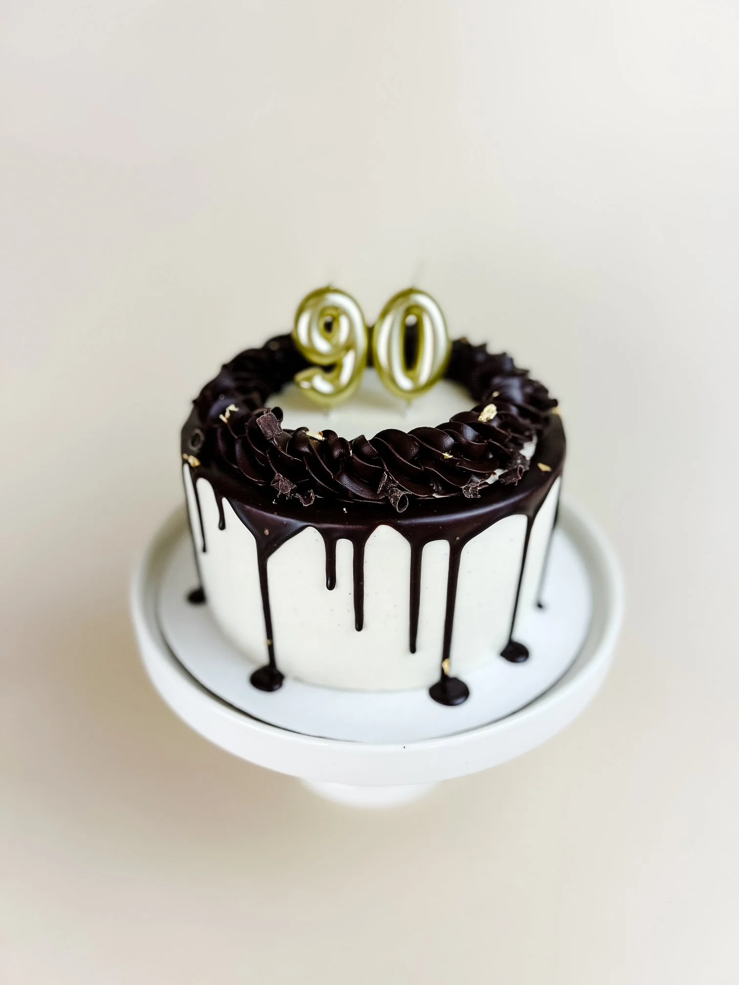 Elevated Chocolate and Vanilla Cake with number candles.JPG