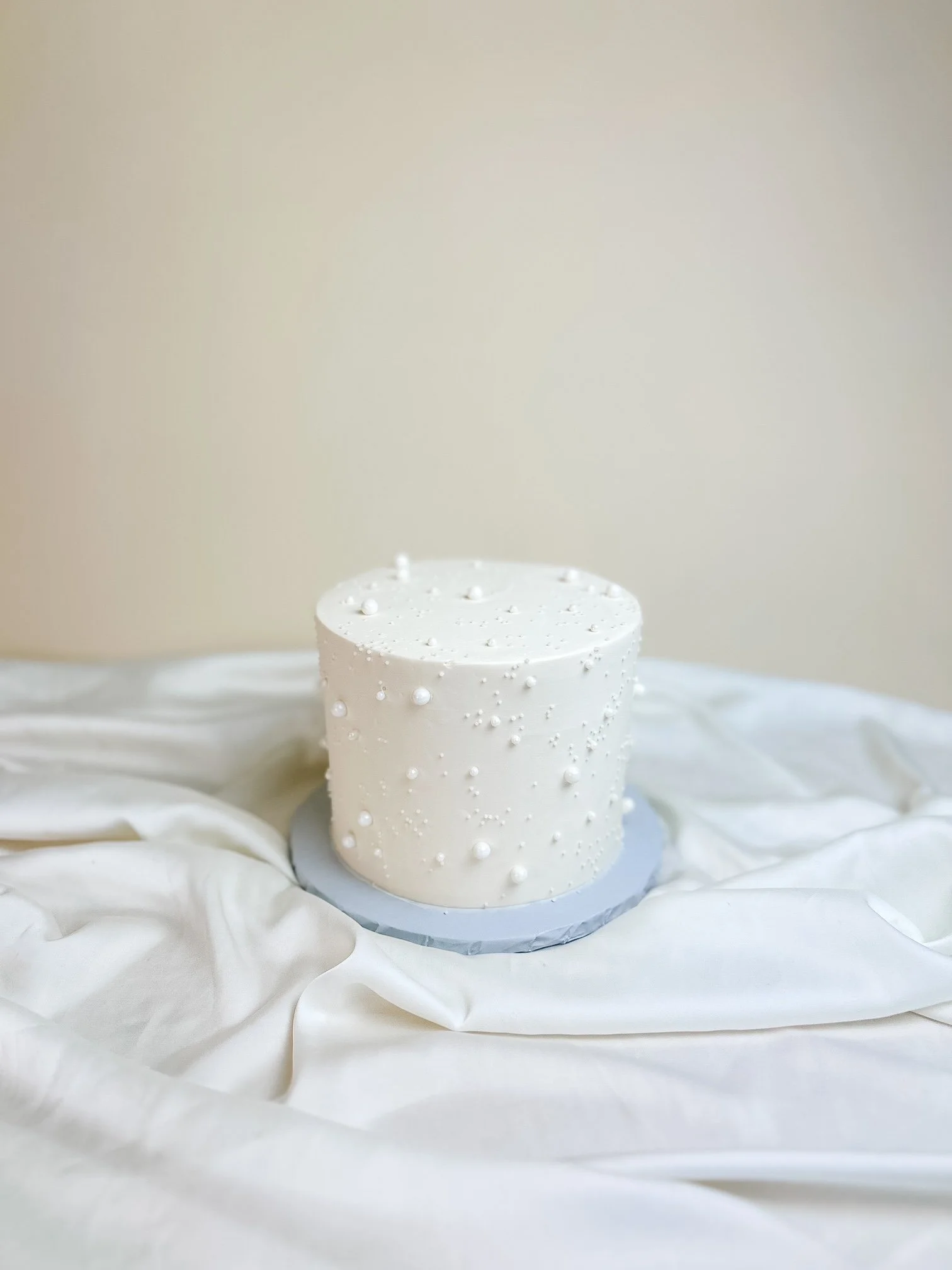 pearl cake on satin cloth