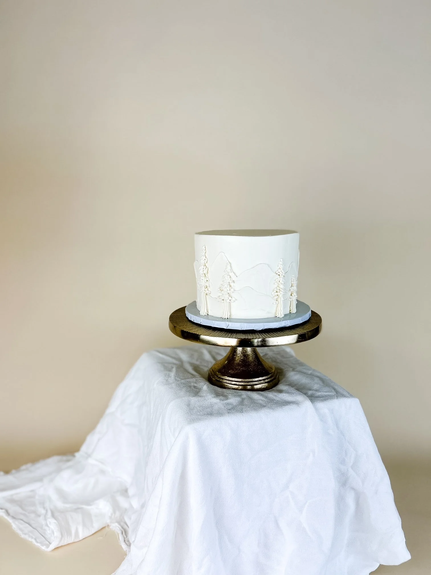 painted redwood trees cake on stand