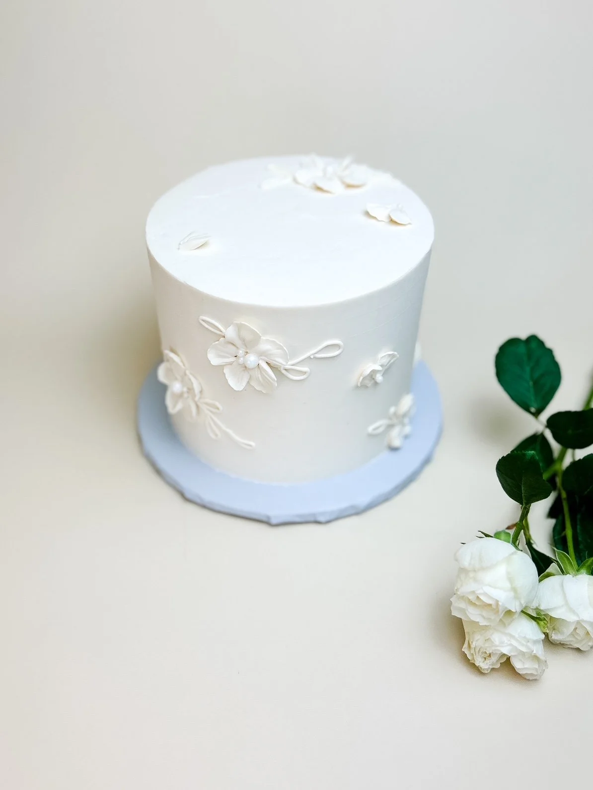 white painted floral cake